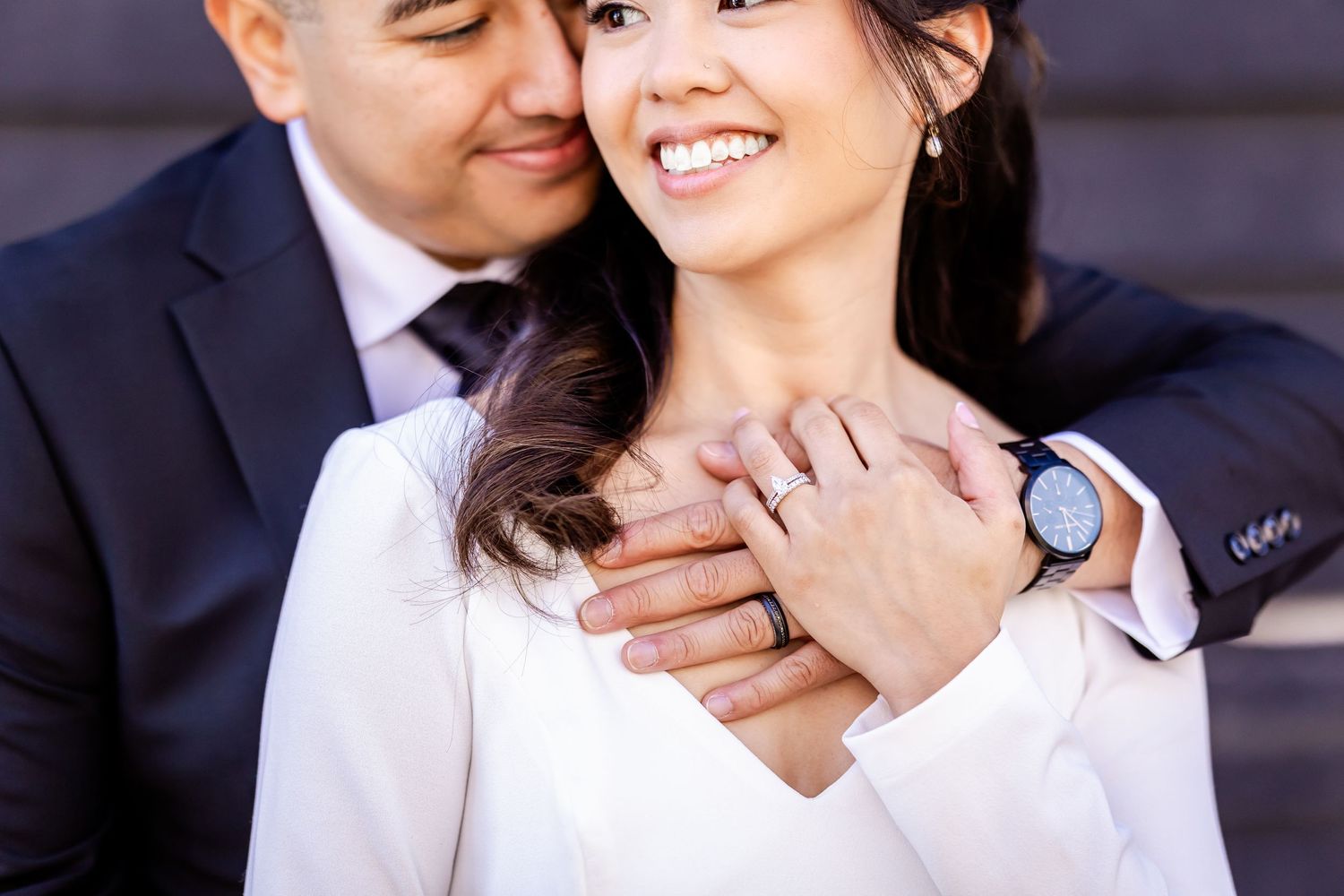 Close-up wedding portrait showing genuine joy and affection between the couple.