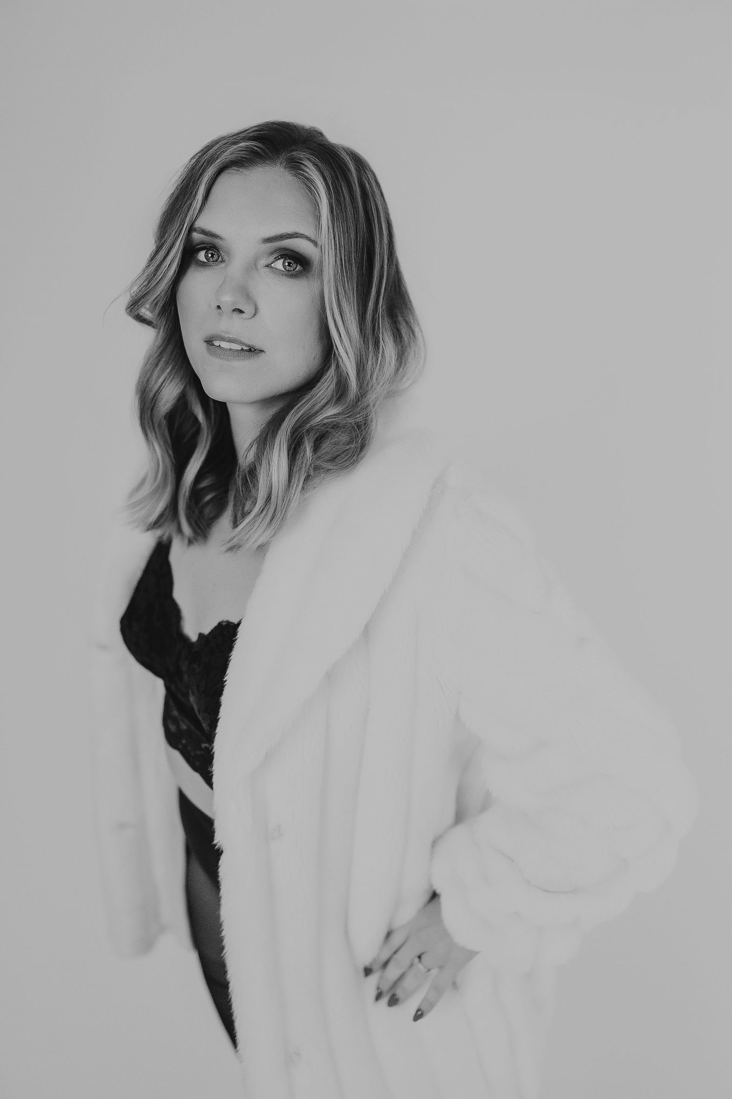 Black and white portrait photography series featuring soft lighting and elegant poses.