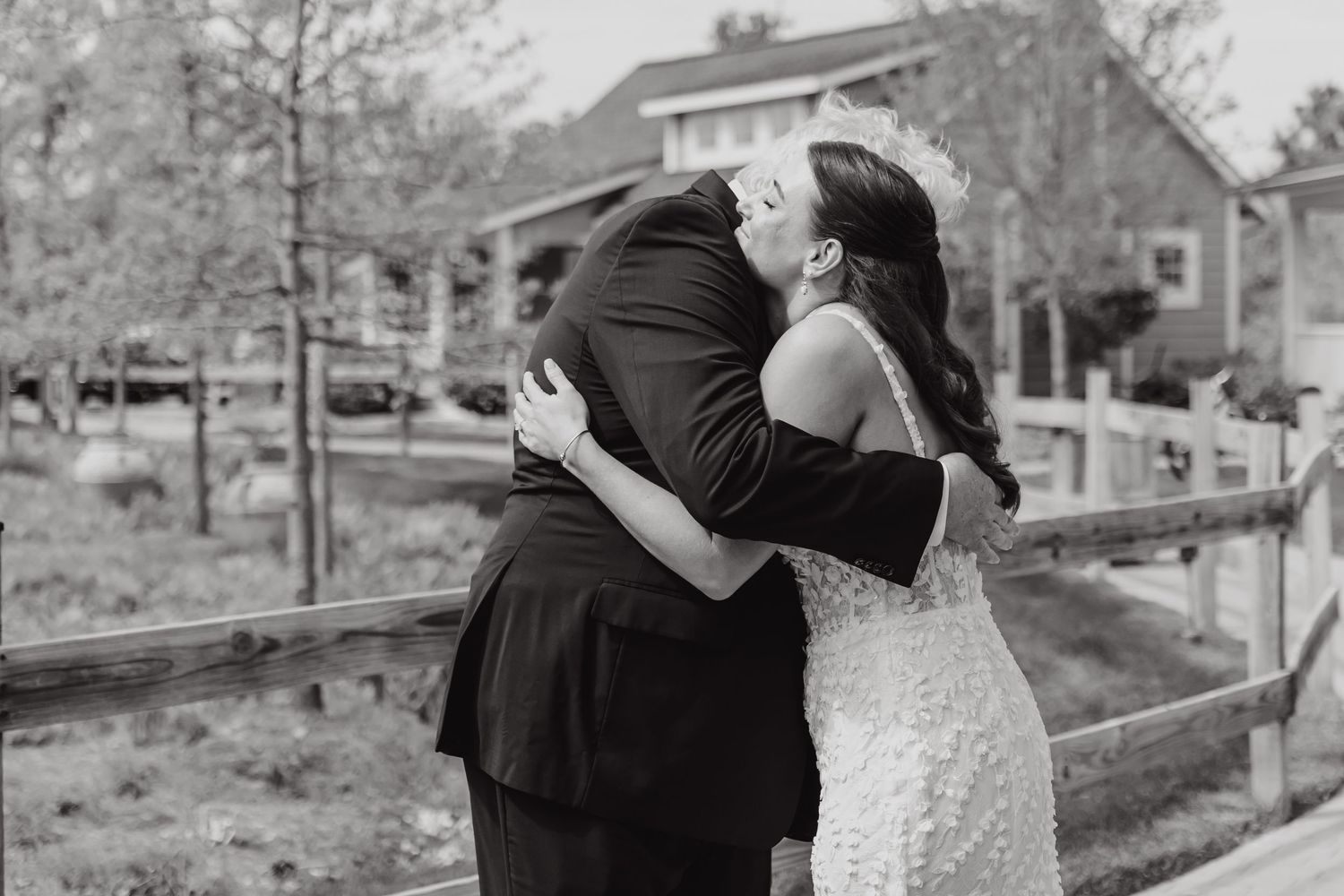 Black and white romantic wedding photos showing intimate moments in an outdoor setting.