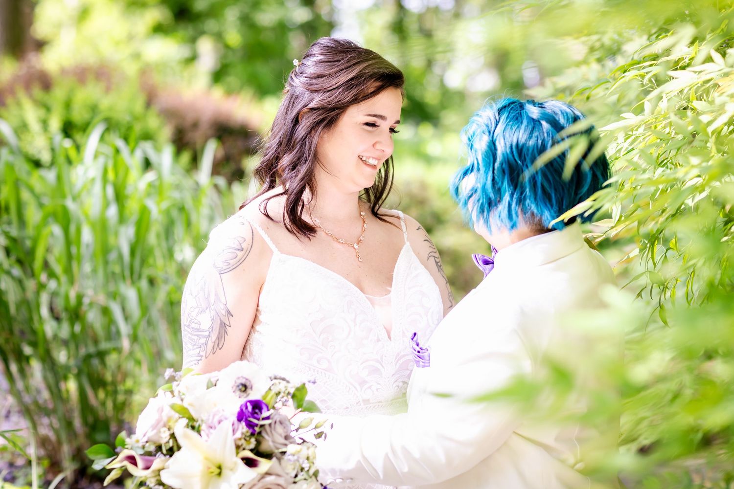 An intimate wedding portrait in a lush garden setting with soft natural lighting.