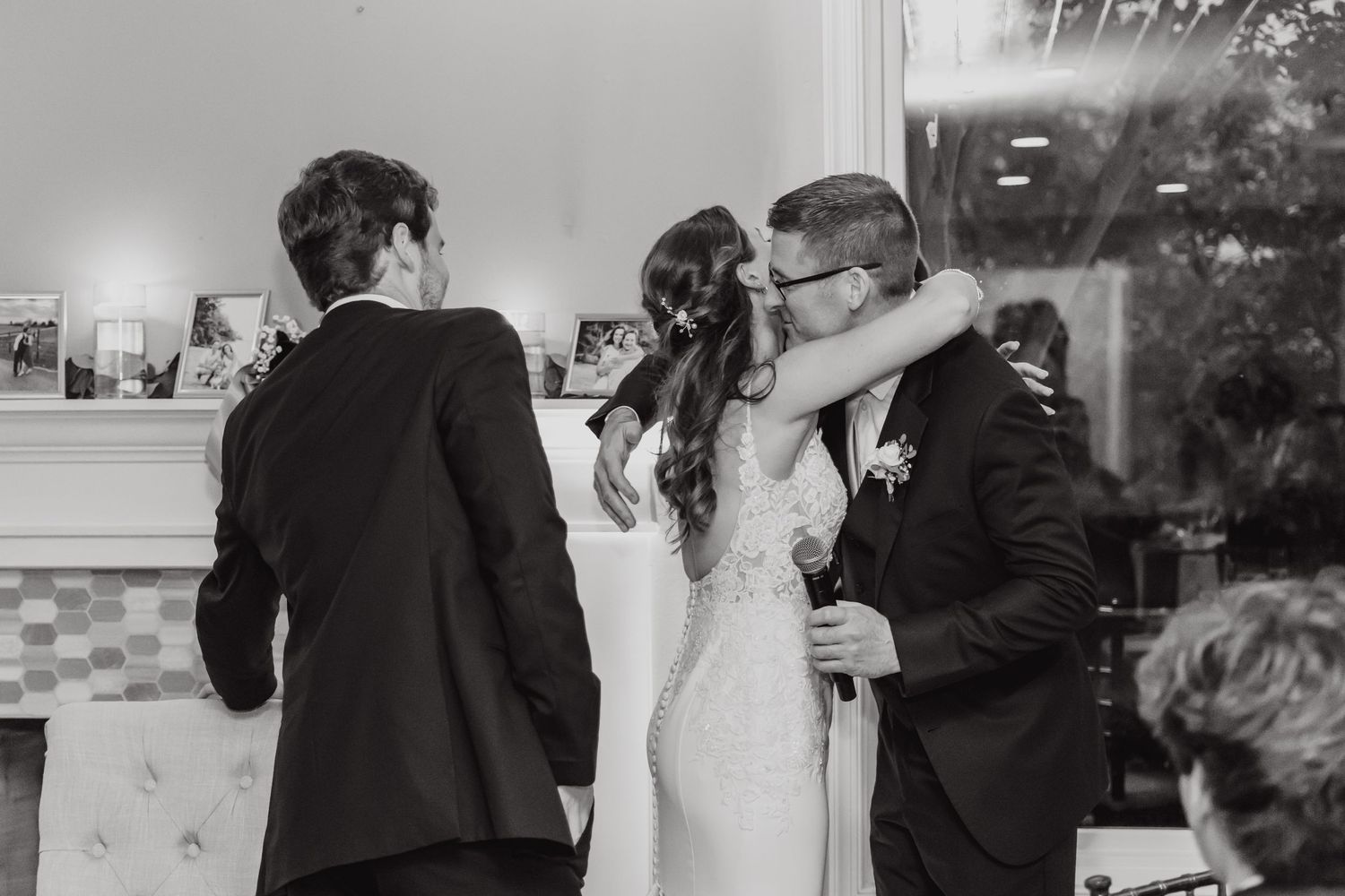 Wedding party dancing and celebrating during reception festivities.