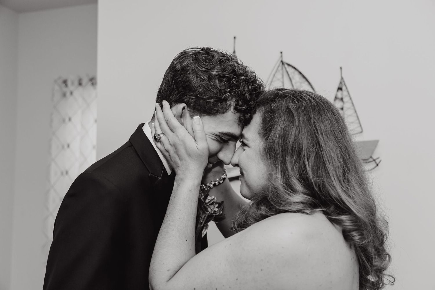 Intimate black and white wedding moments captured in a series of close-up shots.