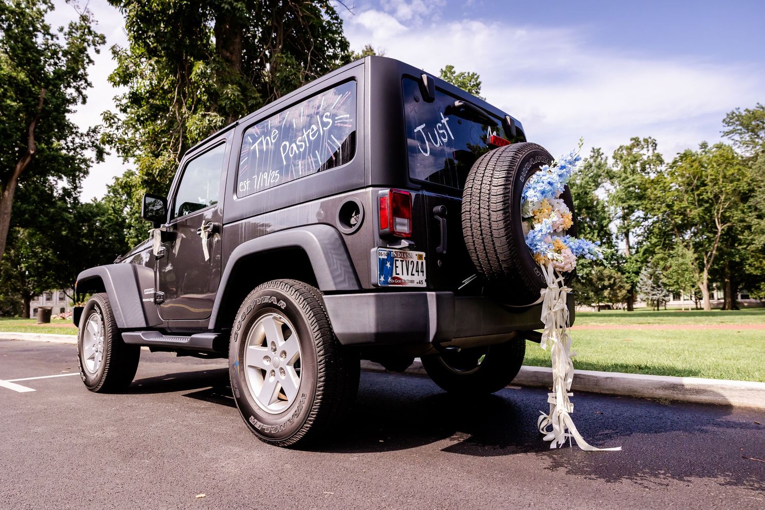Low-angle shots of Jeep Wranglers parked in sequence on a sunny day.