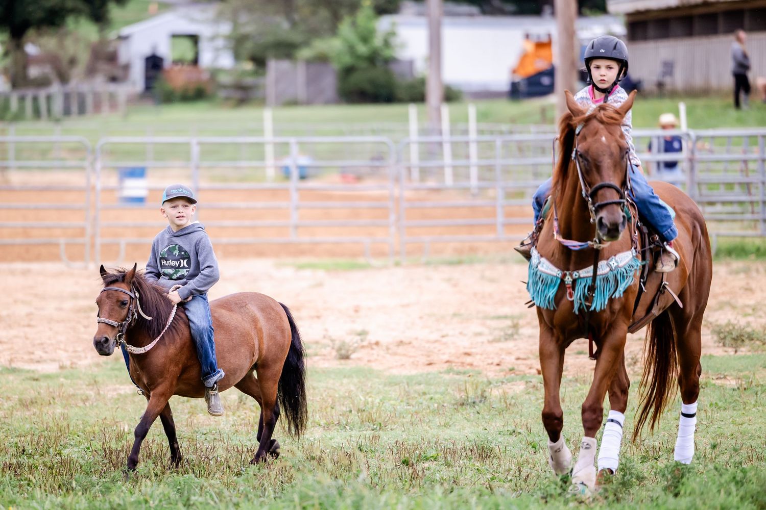 Horse riders practicing together in a casual training session.