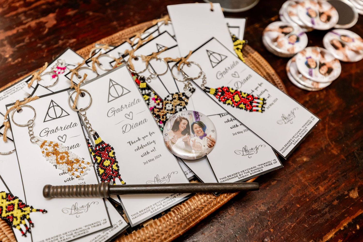 Harry Potter themed wedding menus and decorative items displayed on wooden surface.