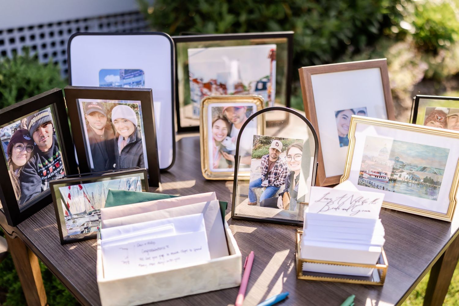 Display of framed family photos and memorabilia at wedding reception.