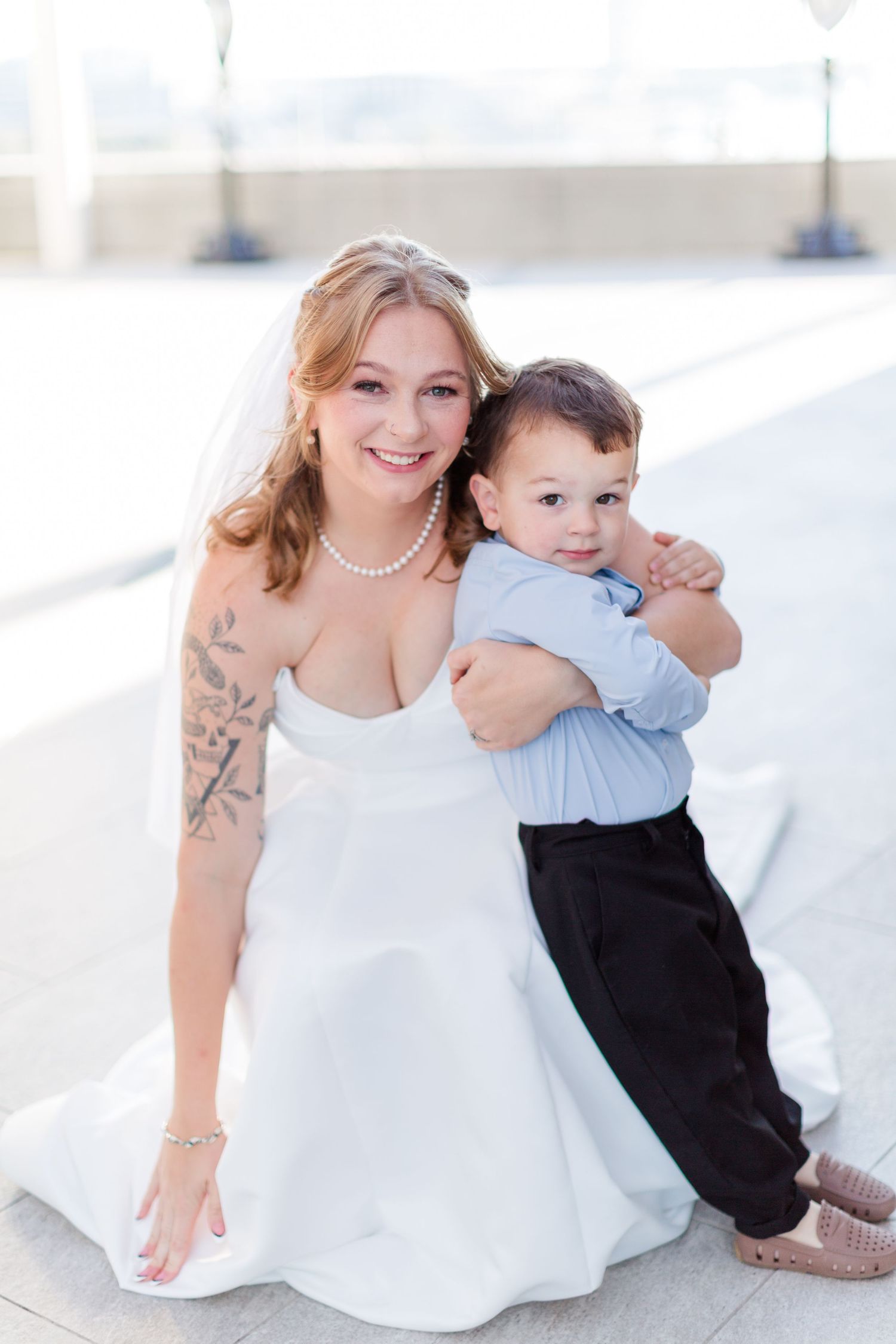 Wedding celebration moment captured in bright natural setting.