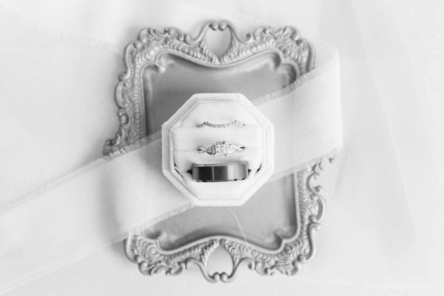 Ornate vintage white decorative mirrors arranged in a minimalist style against white background.