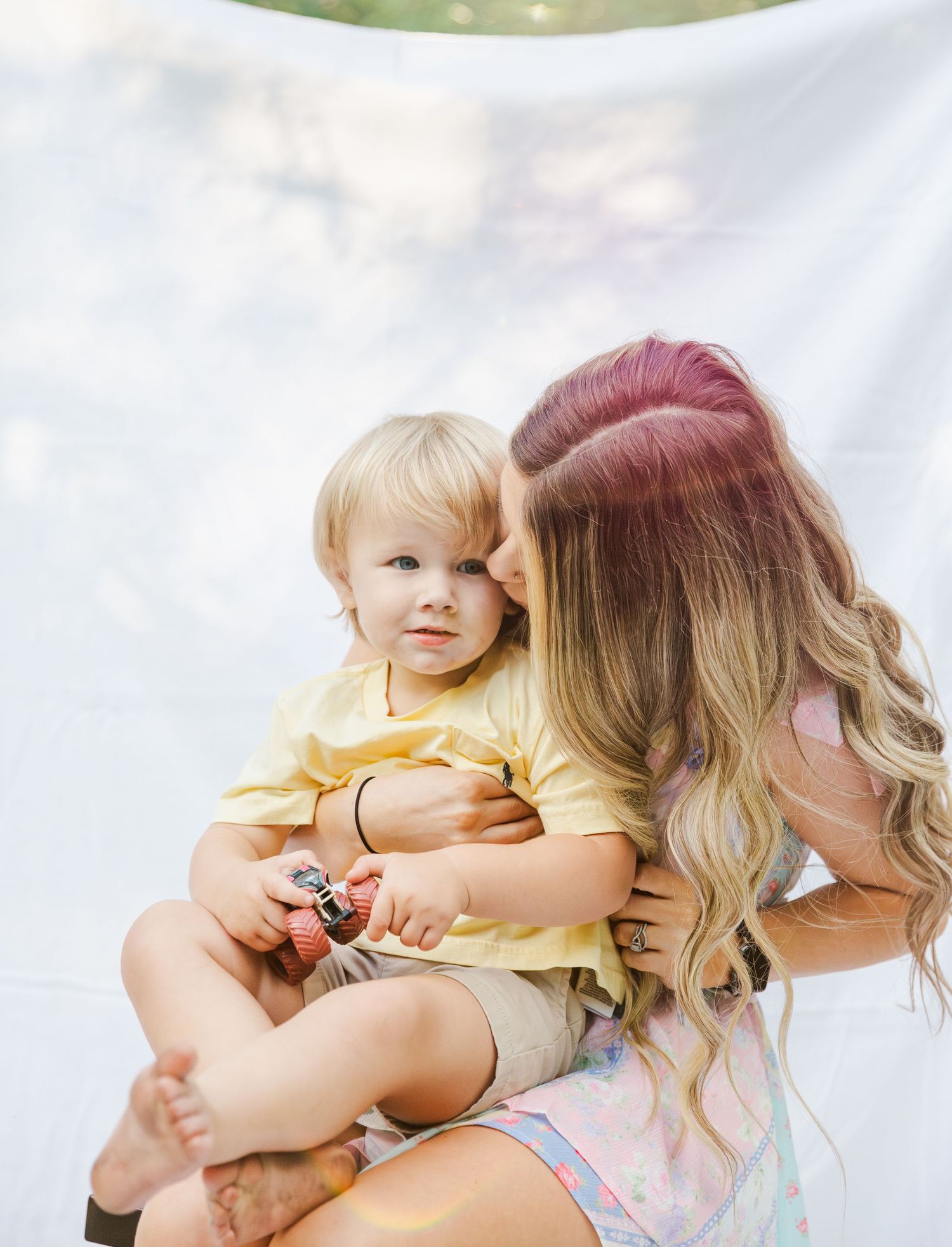Sweet cuddles and embraces shared against a bright white background.