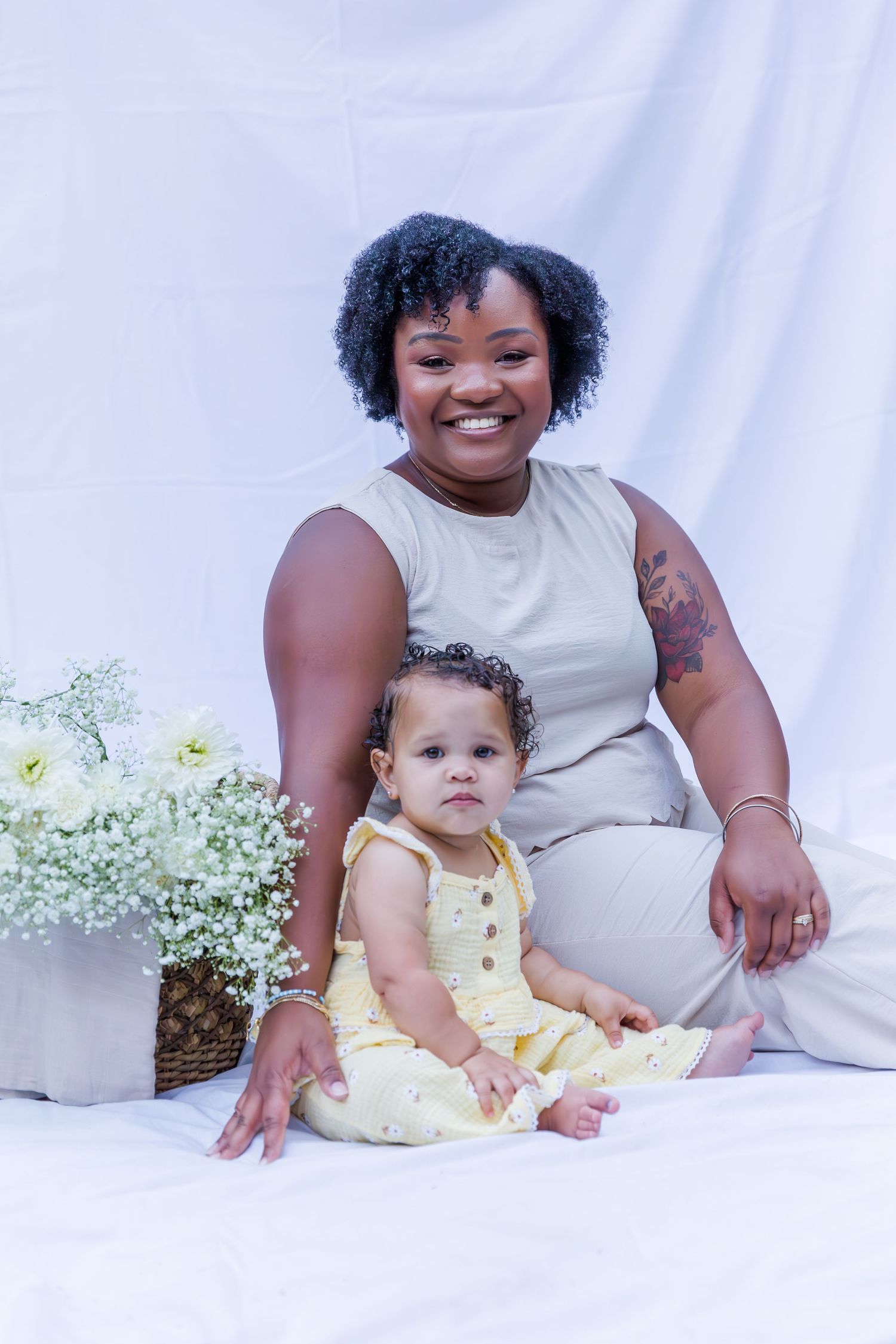 A heartwarming studio portrait session with baby's breath flowers as decoration.