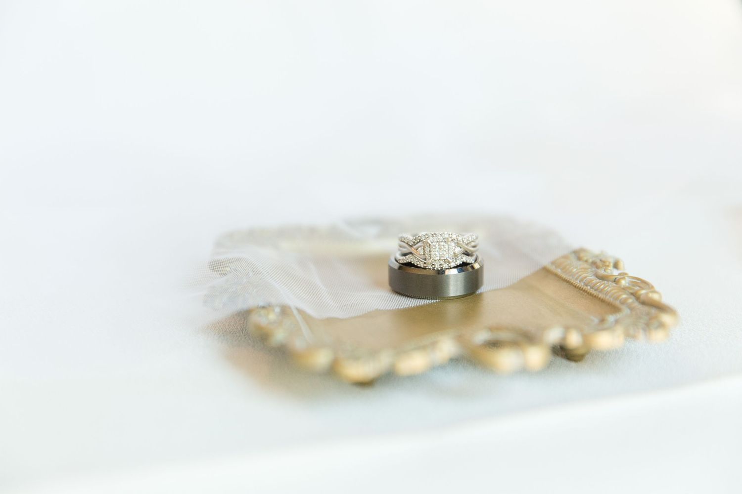 Delicate wedding accessories photographed with shallow depth of field.