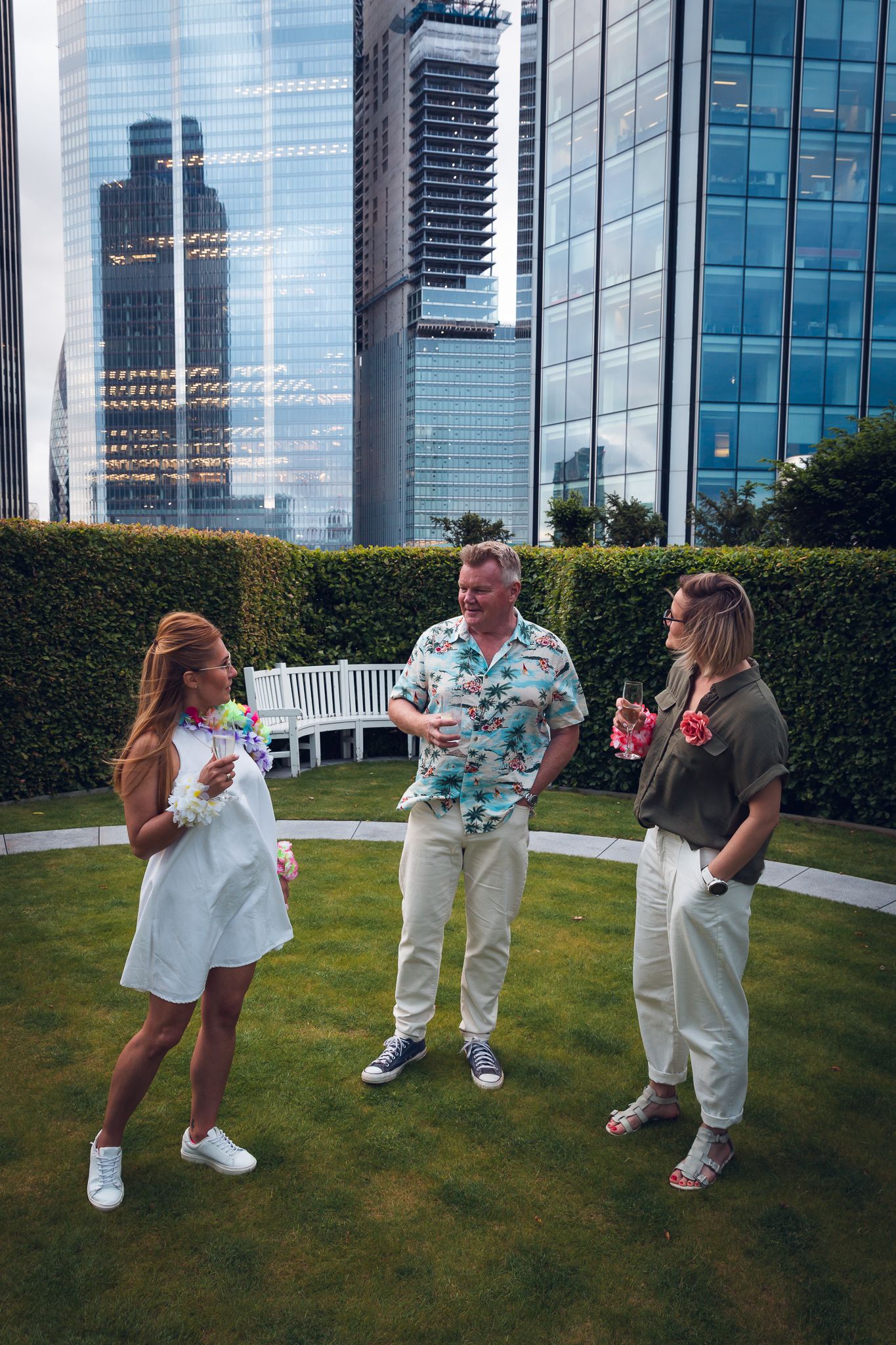 corporate summer party photography in London – tropical themed company event in garden setting