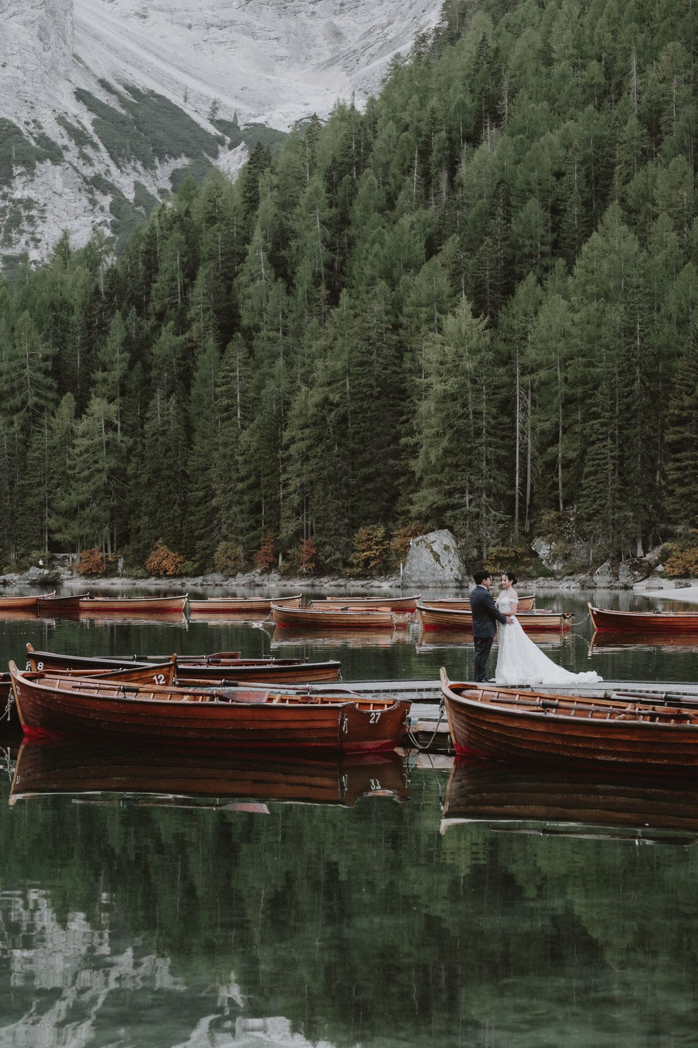 lakeside wedding photography  – couple exchanging vows outdoors