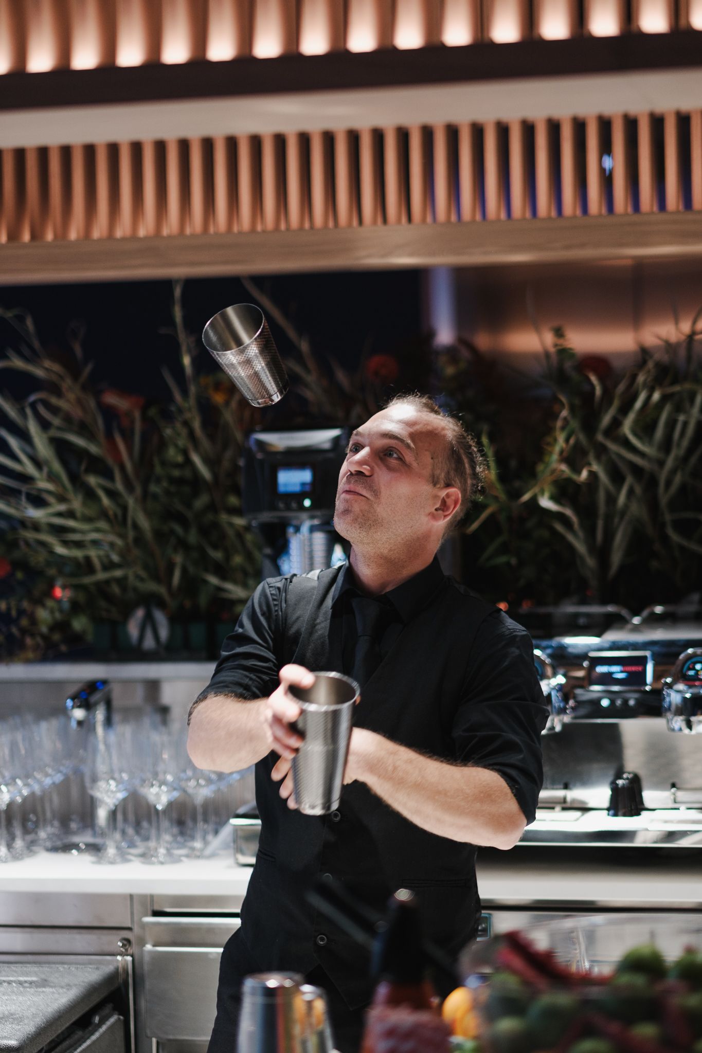 event and brand photography in London – bartender mixing cocktails behind bar