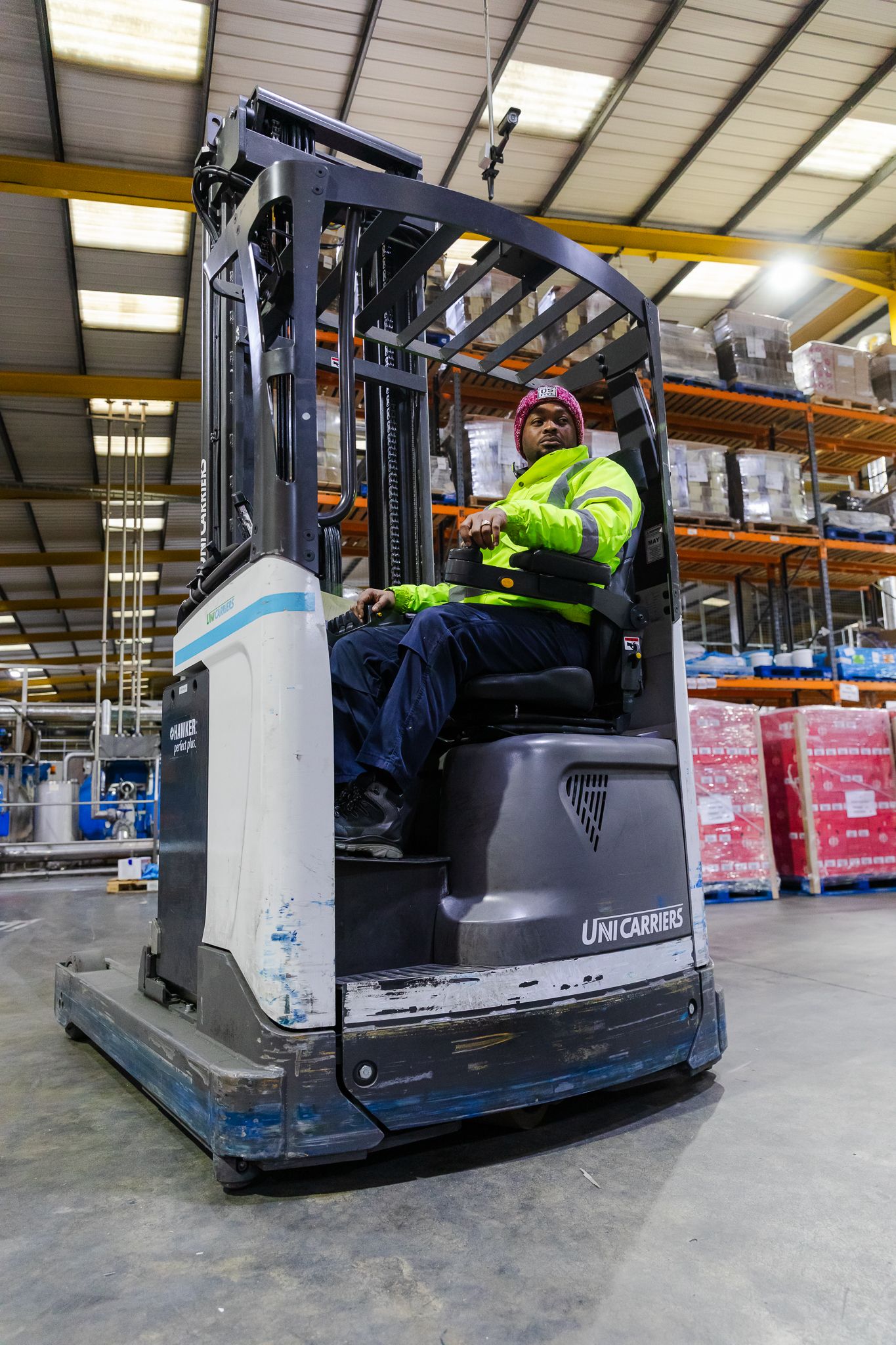 factory environment photography in Kent – worker driving forklift in warehouse