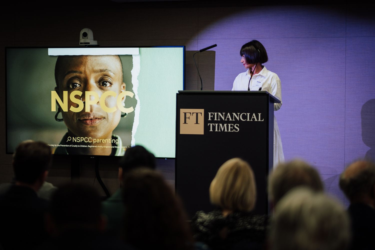professional event photography in London– attendees listening to keynote speaker