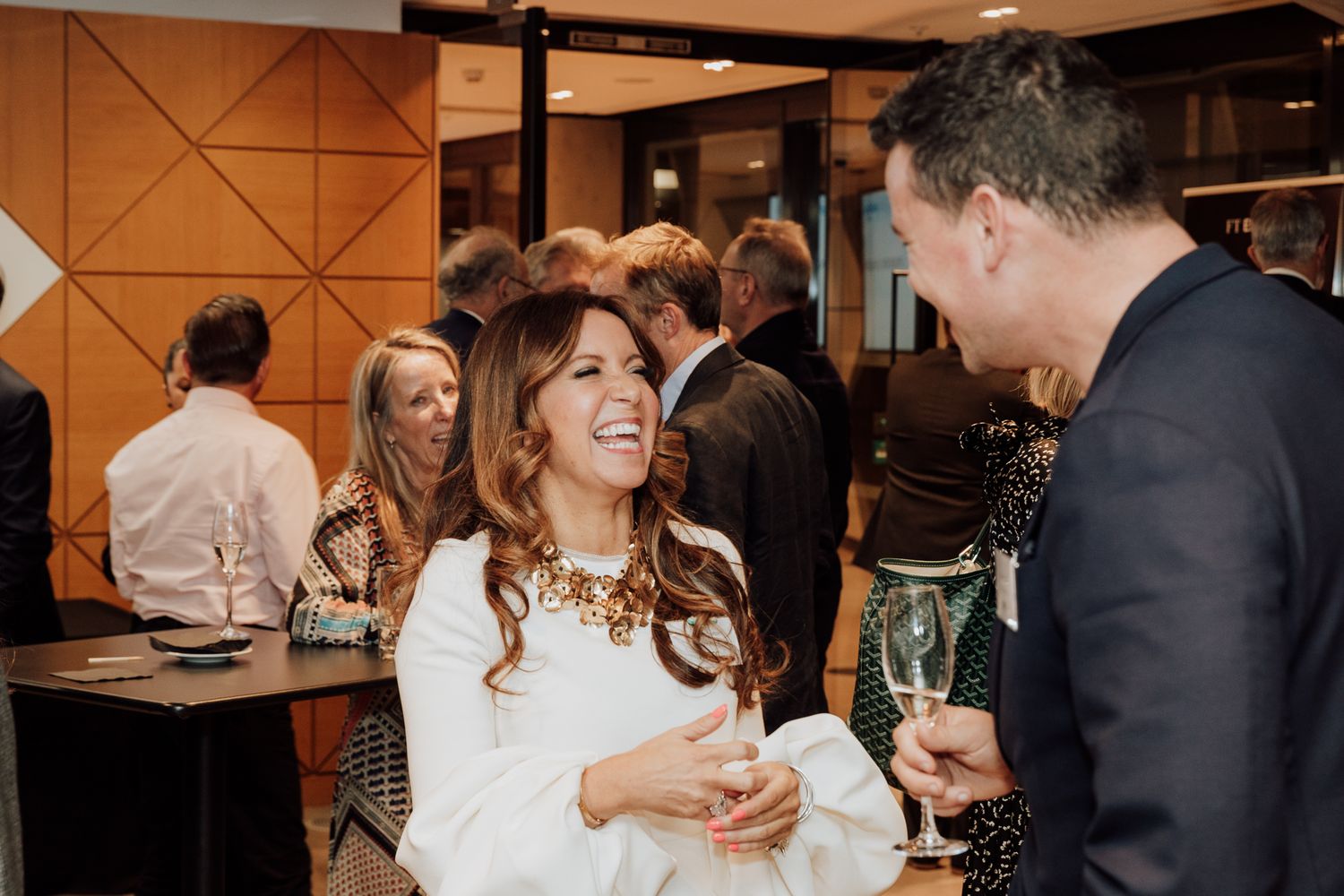 business event photography in London – relaxed networking with drinks at reception