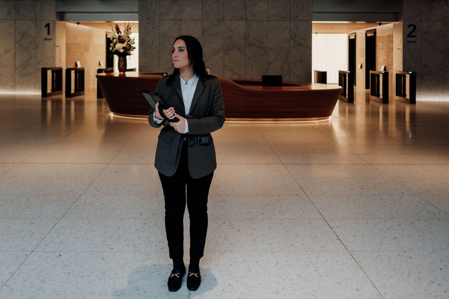 brand photography in London – guest interaction at reception