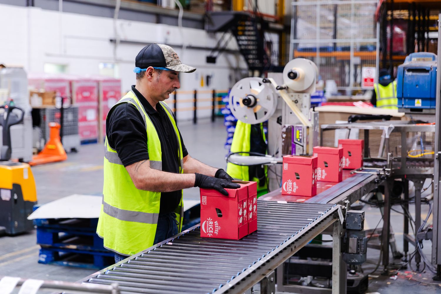 brand story photography in Kent – factory worker packaging rice products