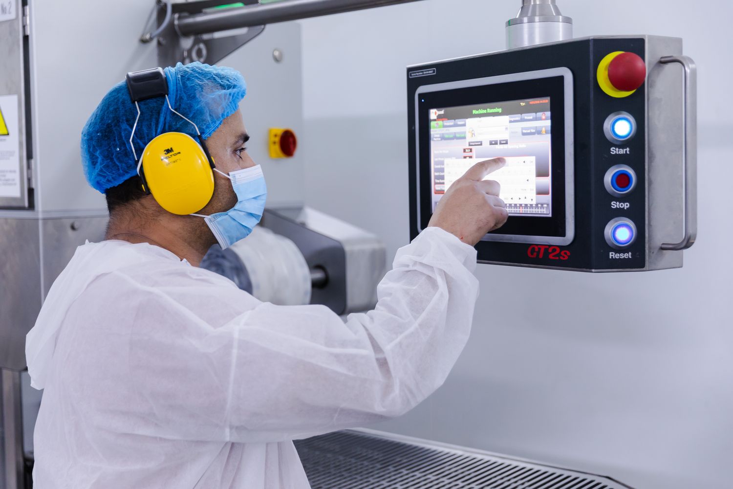 industrial photography in Kent – workers operating machinery in rice factory