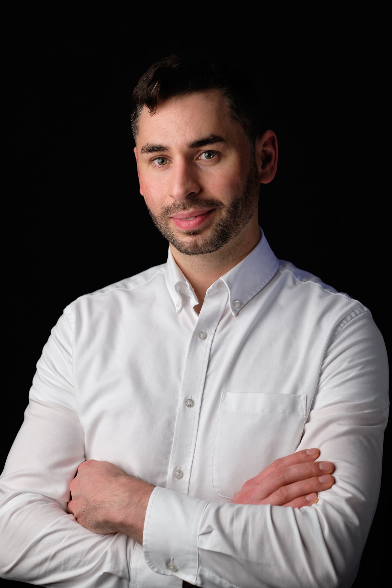 studio portrait photography in London – professional headshot of businessman on dark background