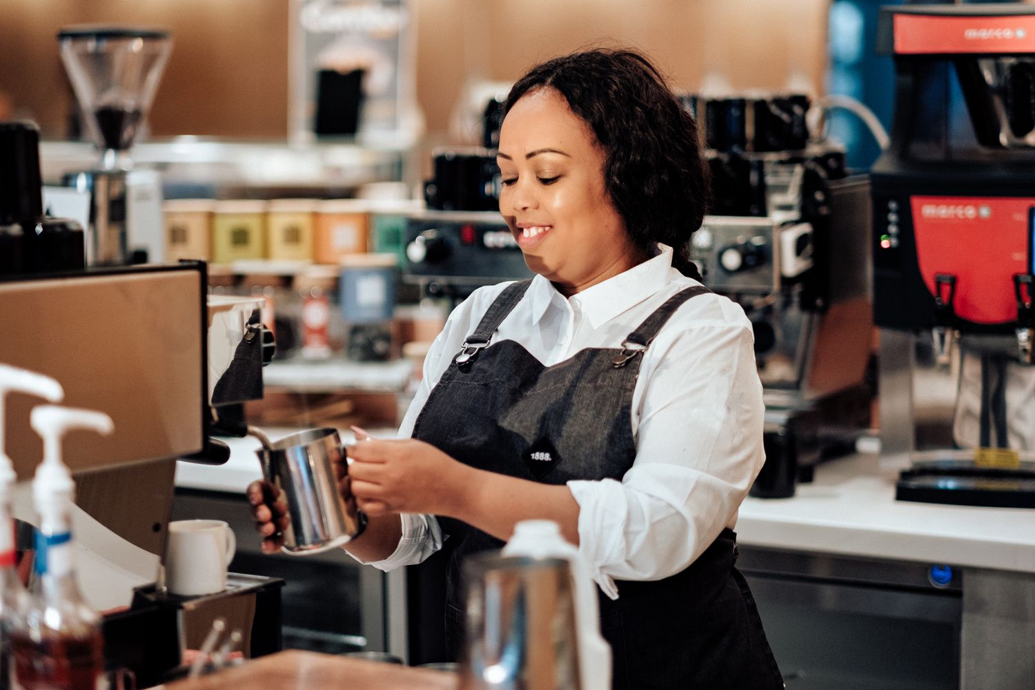 coffee bar photography in London – barista operating espresso machine