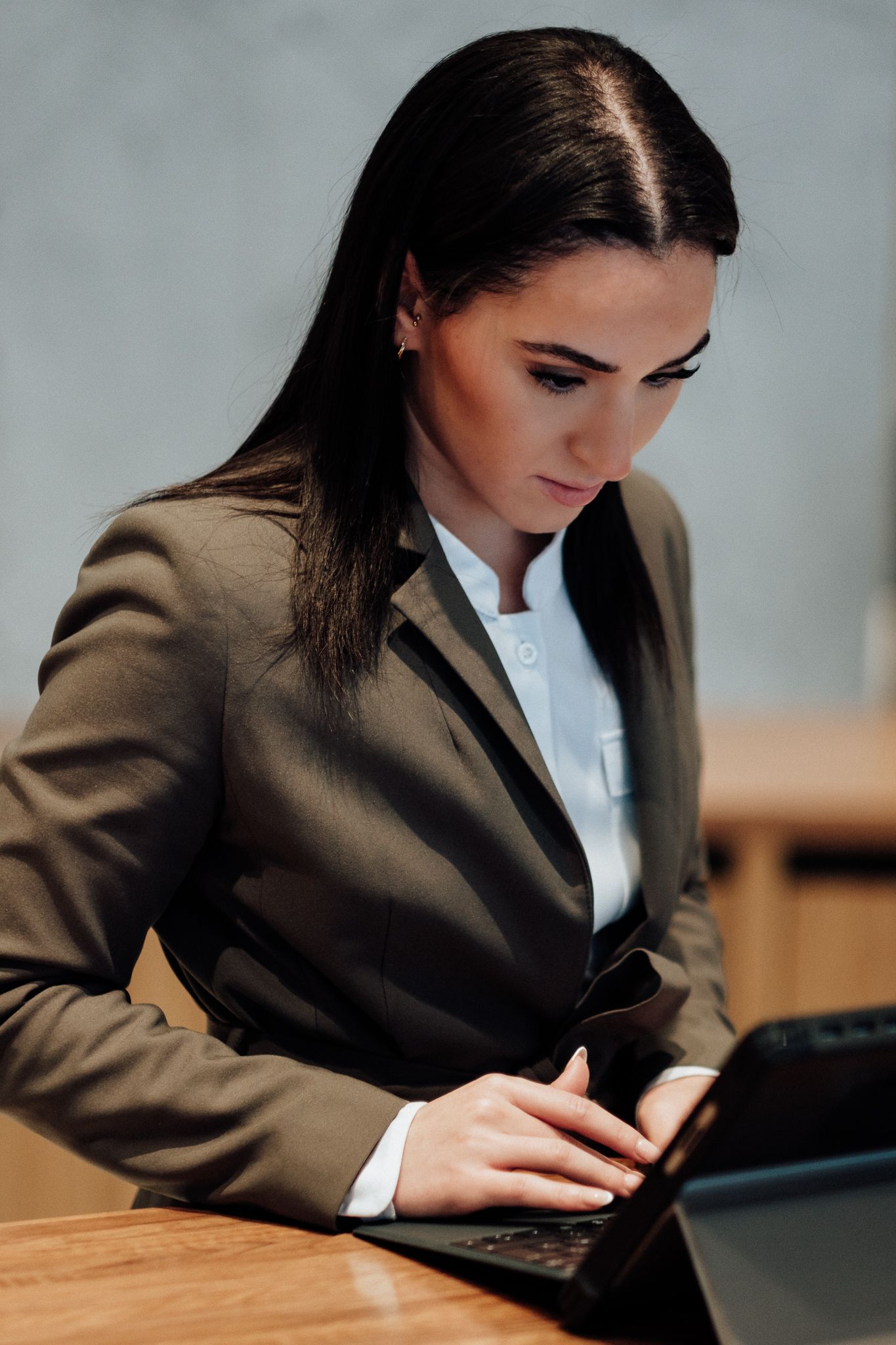 business office photography in London – receptionist working at front desk computer