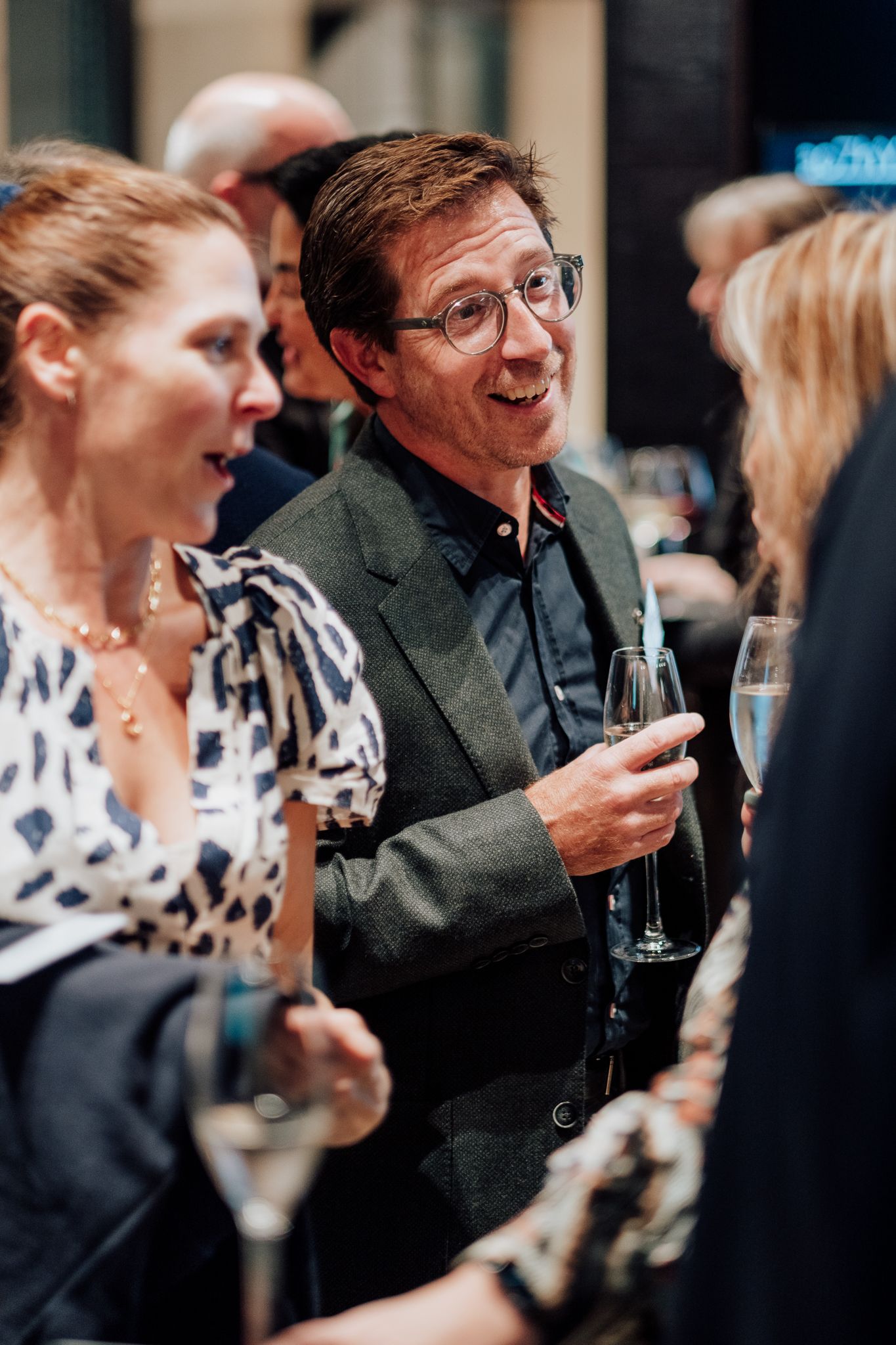 indoor event photography in London – attendees socialising with cocktails