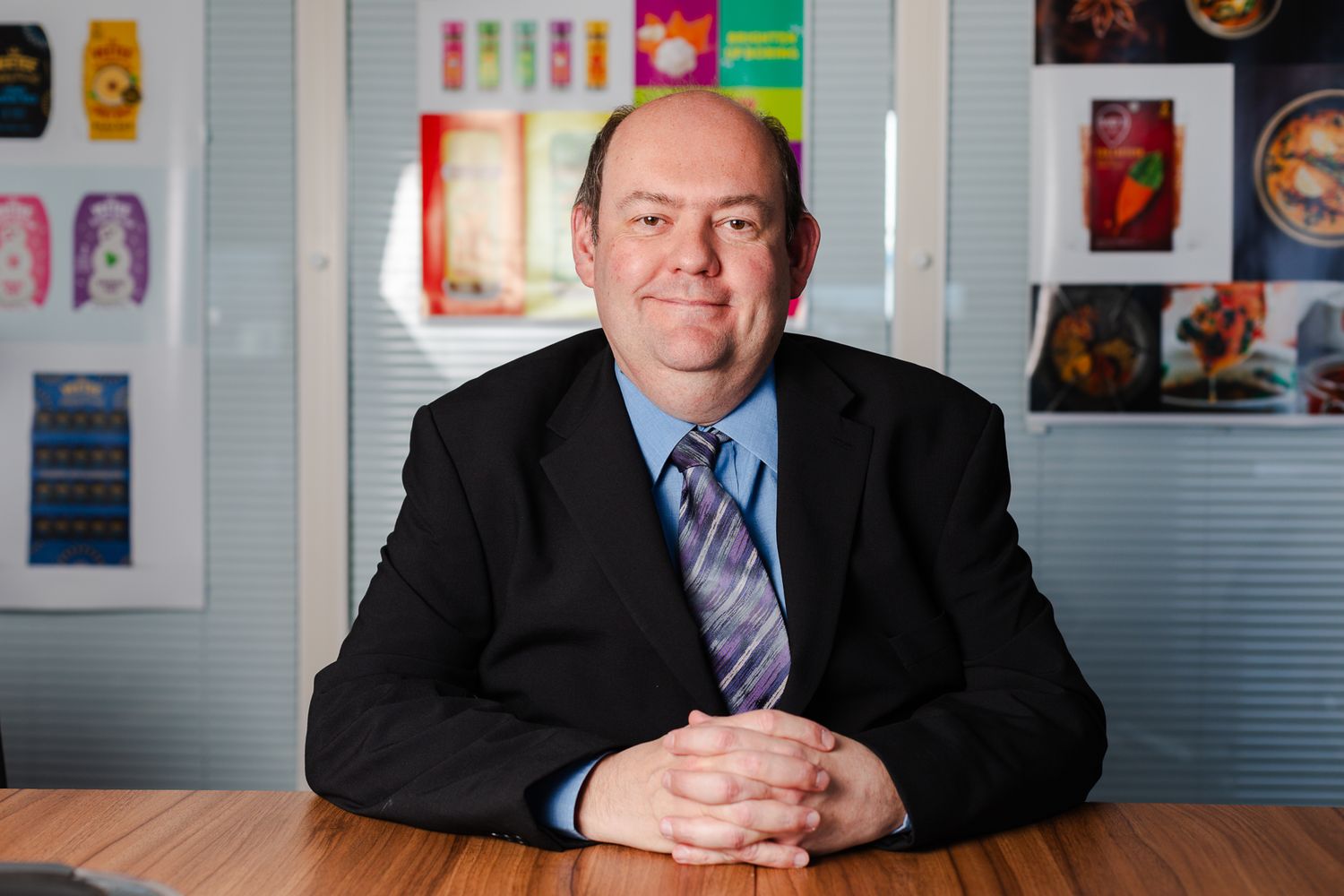 corporate portrait photography in Kent – professional businessman seated in modern office