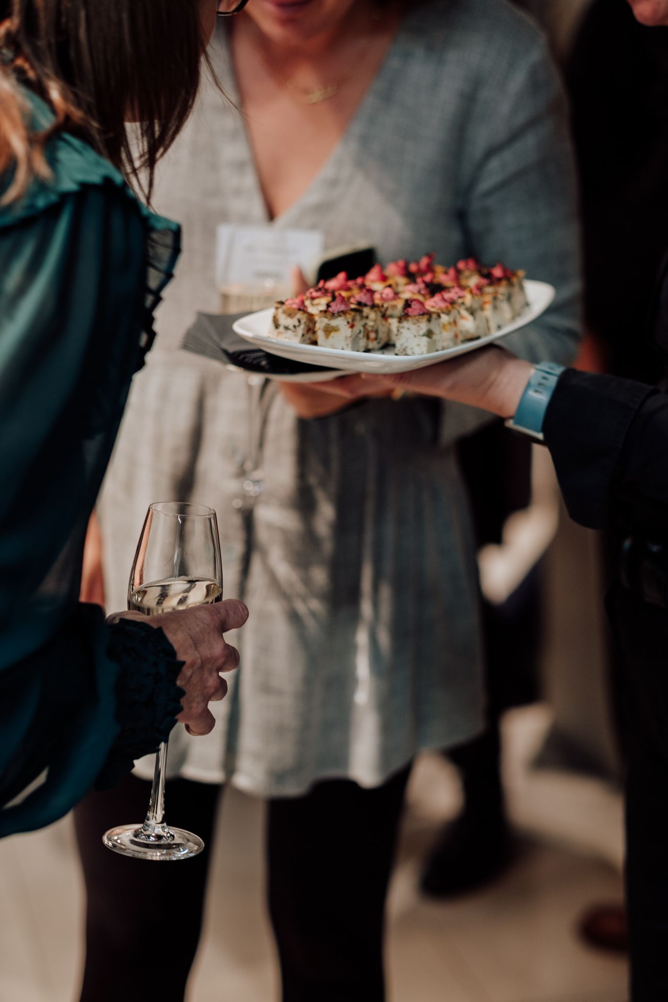 corporate hospitality photography in London– guests enjoying canapés at networking event