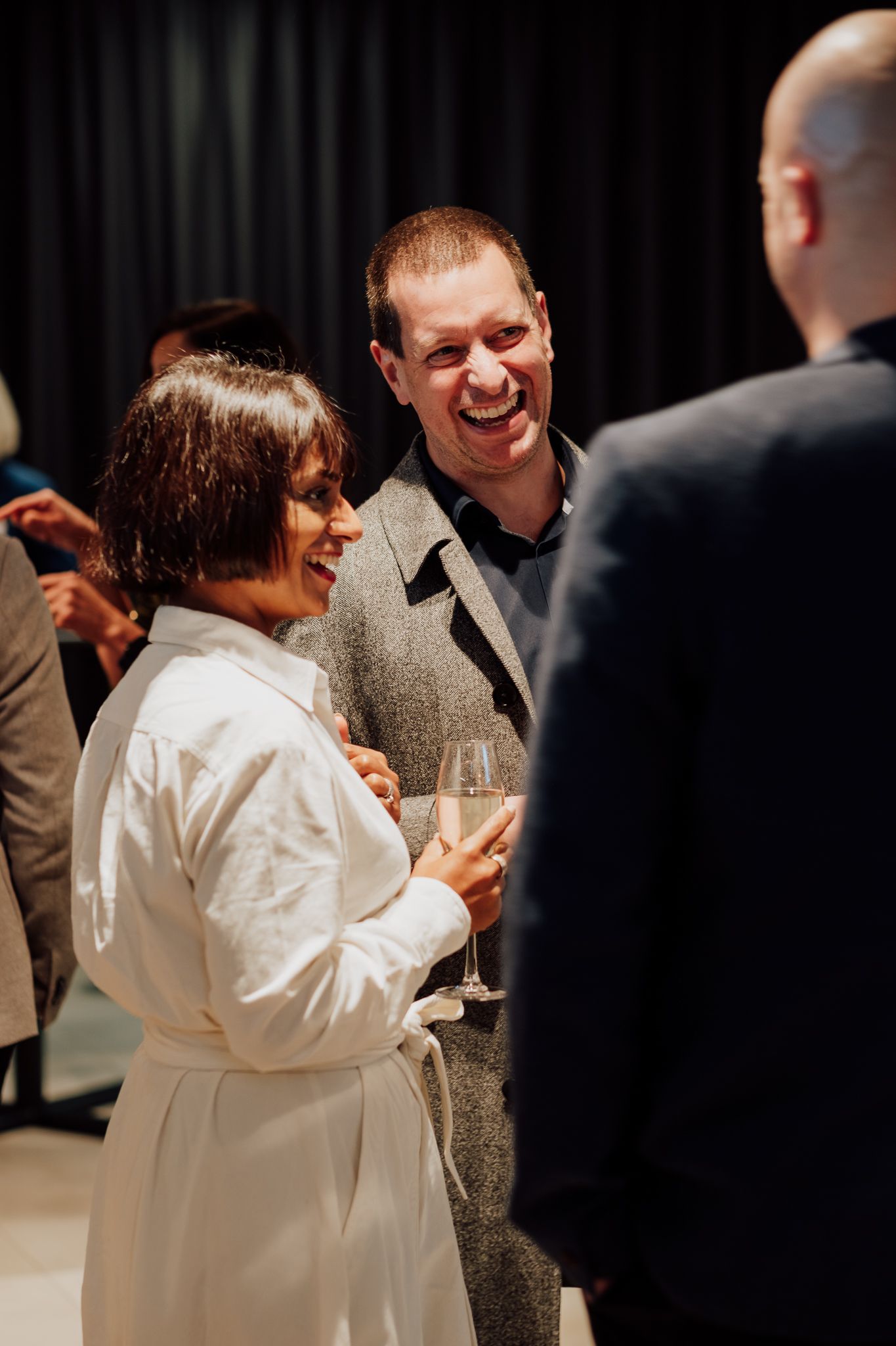 corporate charity event photography in London– attendees networking in modern venue
