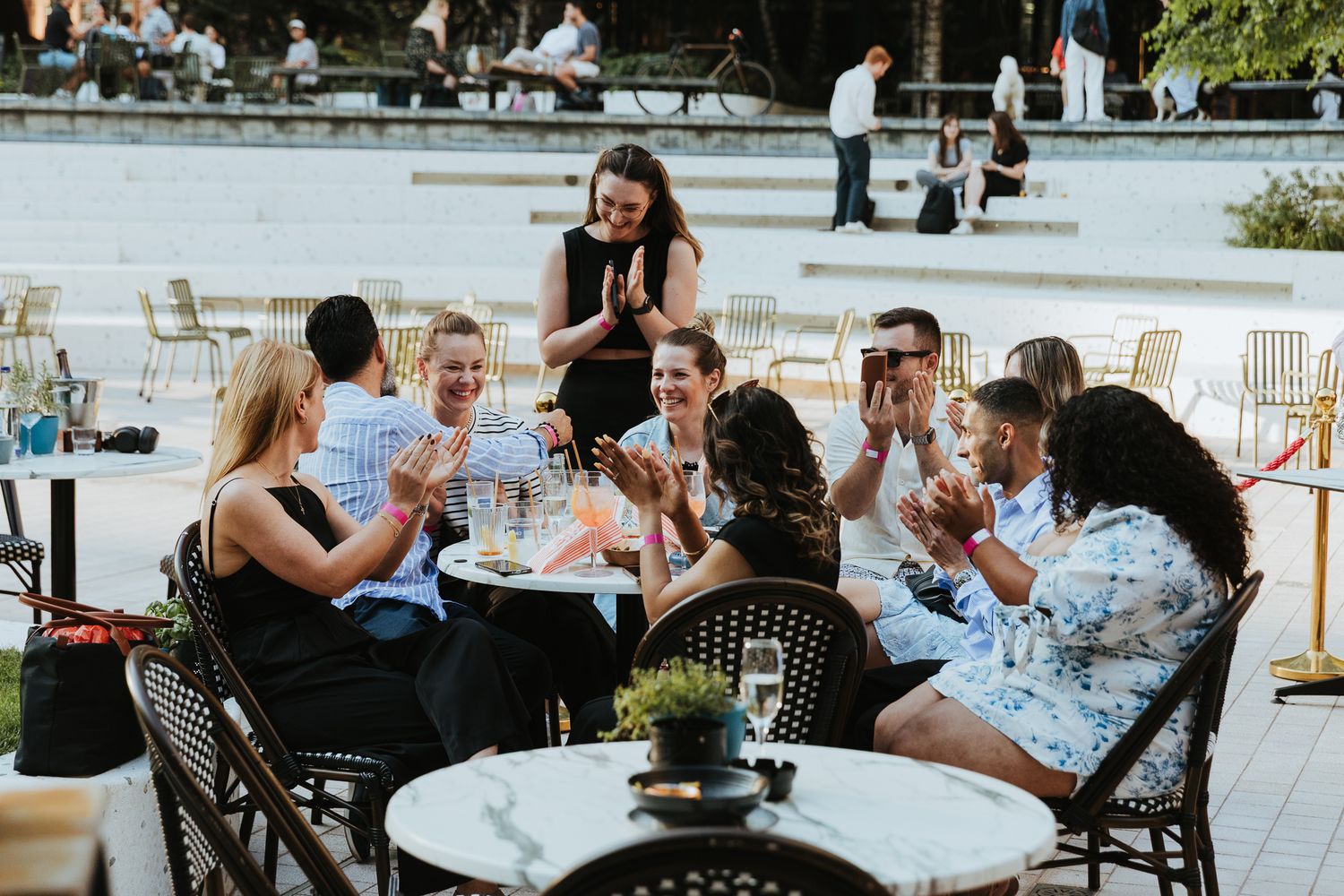 summer party photography in London – guests enjoying drinks outdoors