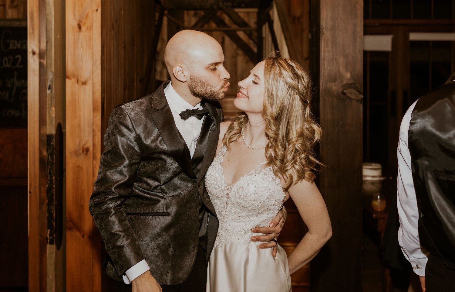 Deirdre and Brodie kissing during their wedding reception.