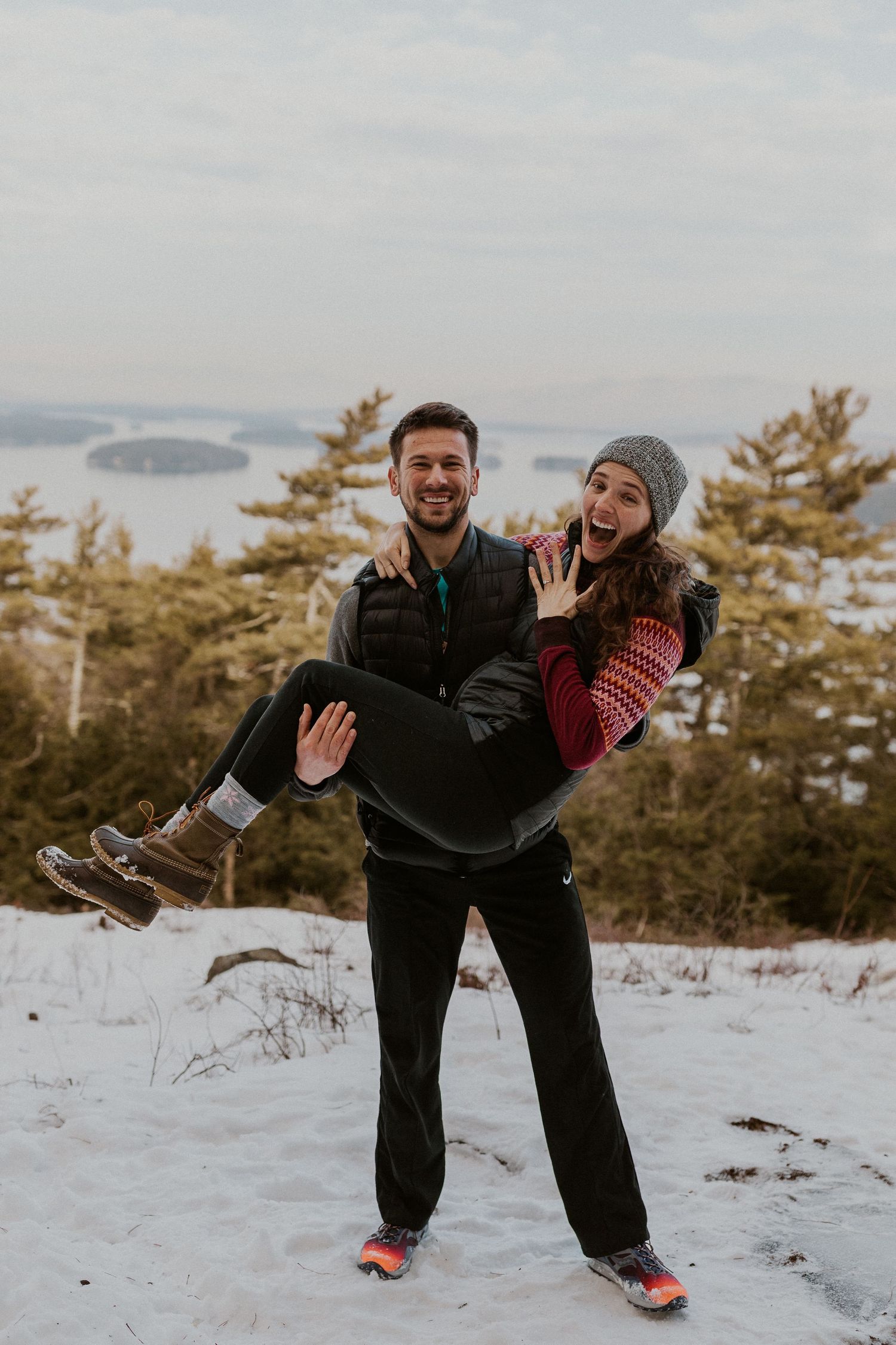 Kirsten and Ivan playfully showing off their new engagement with a celebratory photoshoot!