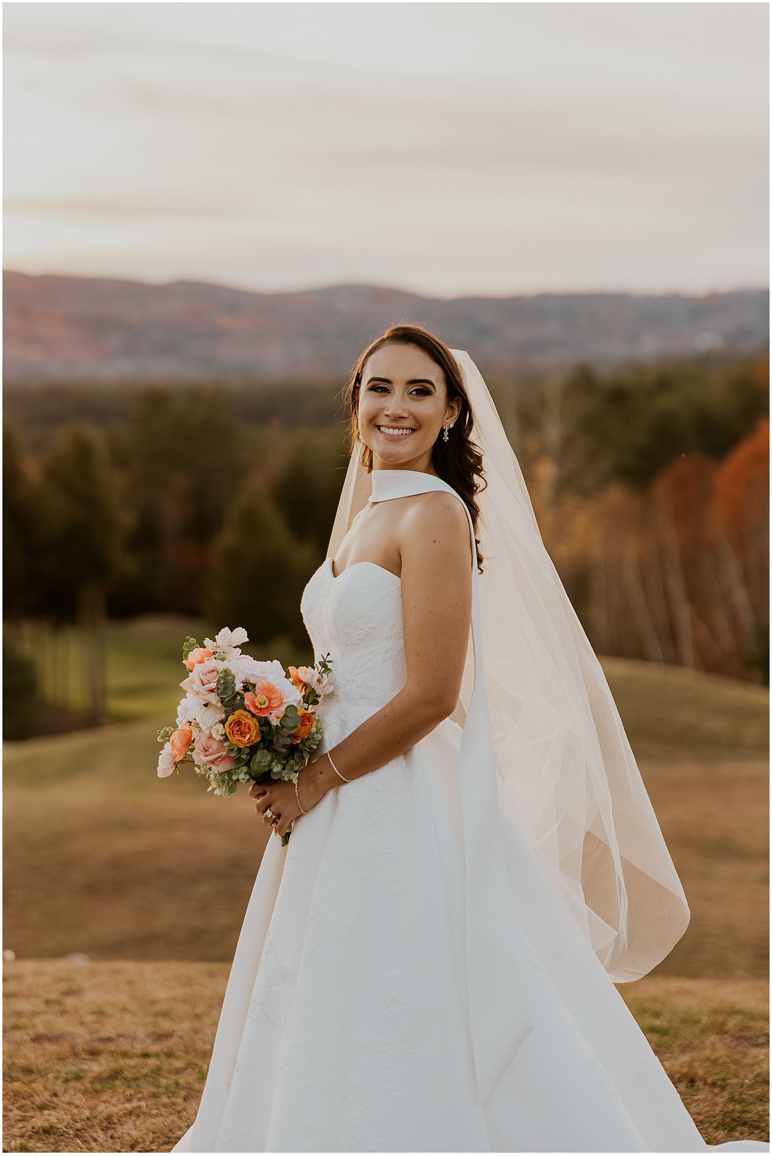 NH bride taking golden hour wedding photos