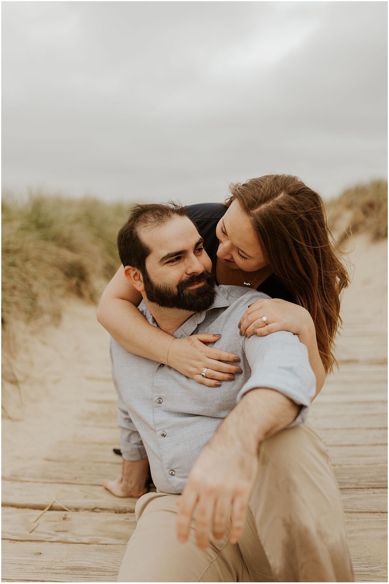 NH couple taking engagement photos at Scusset Beach
