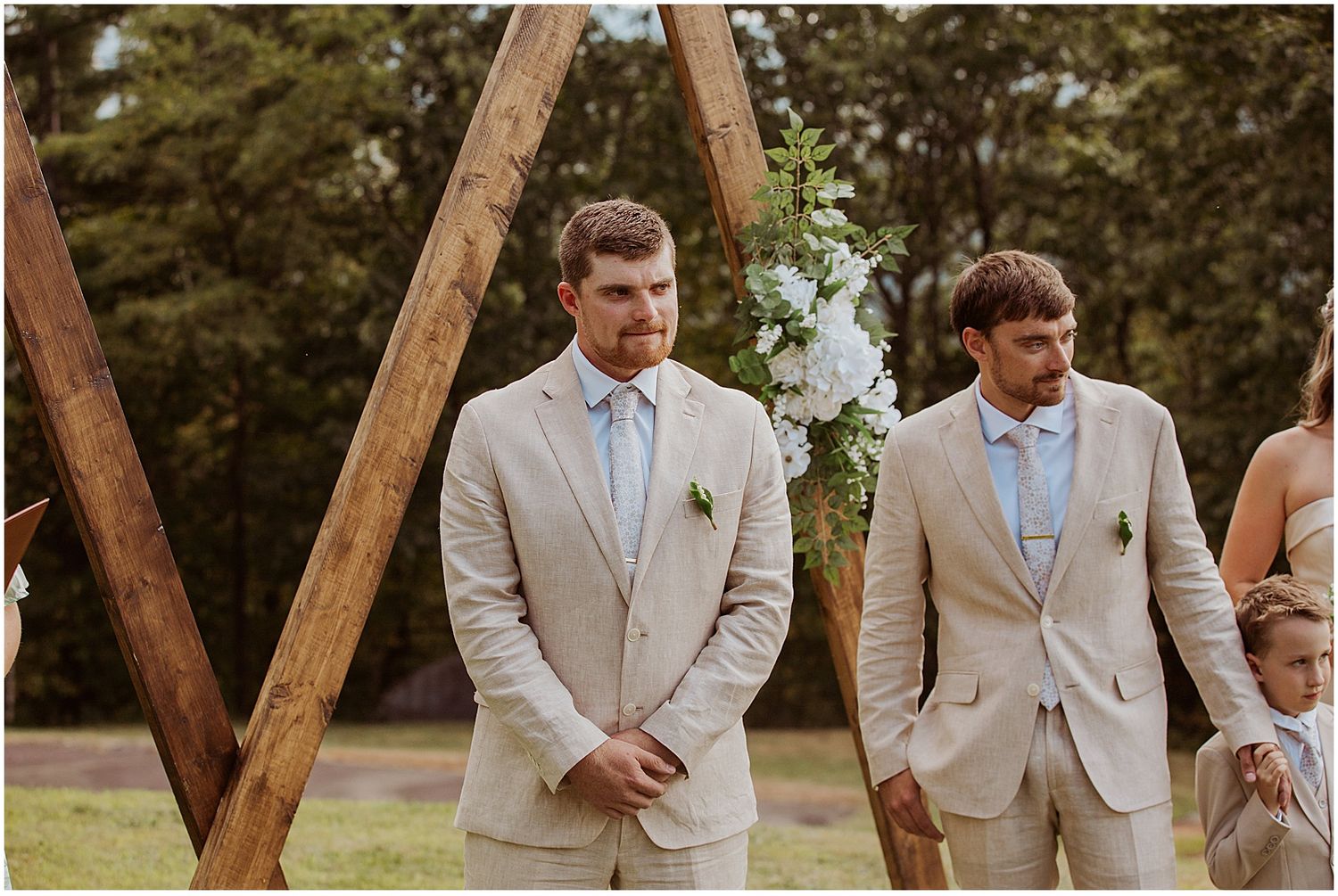 Groom waiting for bride to walk down the aisle at their Maine wedding ceremony