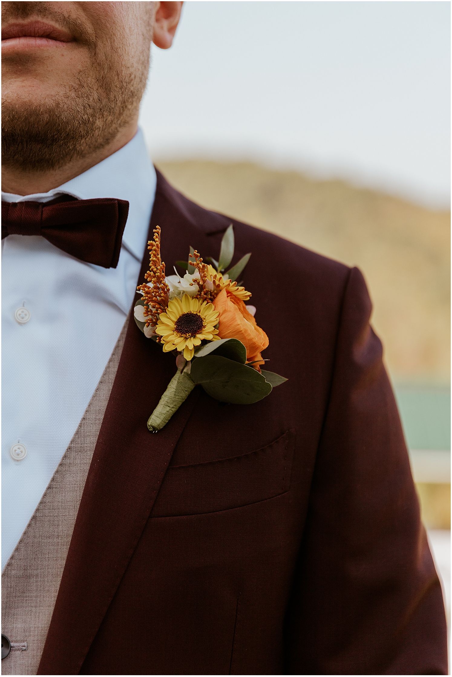 Groom boutonniere with fall flowers in NH