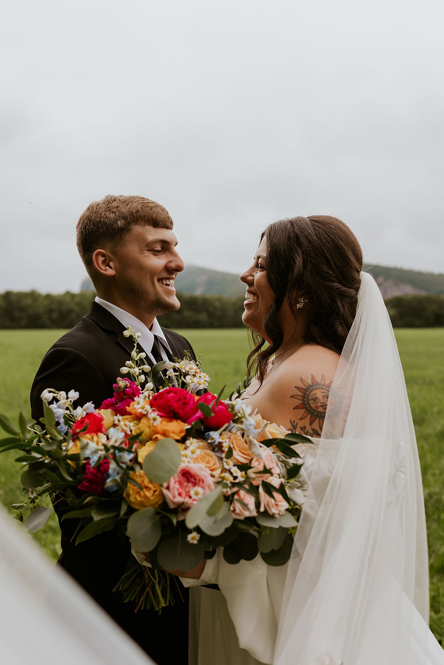 New Hampshire bride and groom taking portrait photos at their White Mountain wedding