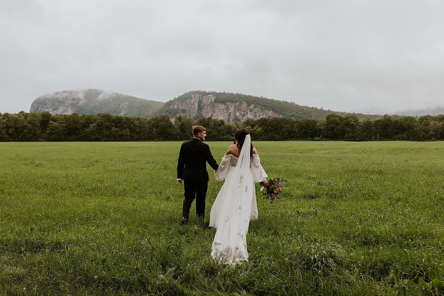 NH bride and groom taking portrait photos at their White Mountains wedding