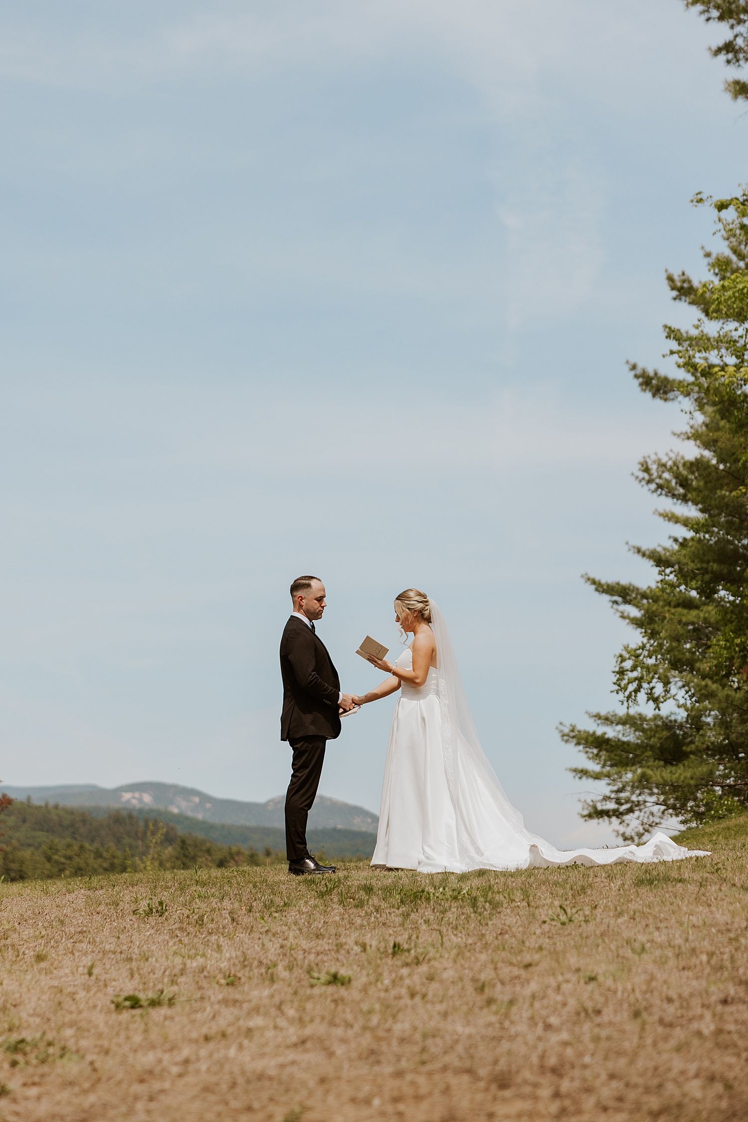 Bride and groom exchanging private vows at their wedding at the Owl's Nest Resort in NH