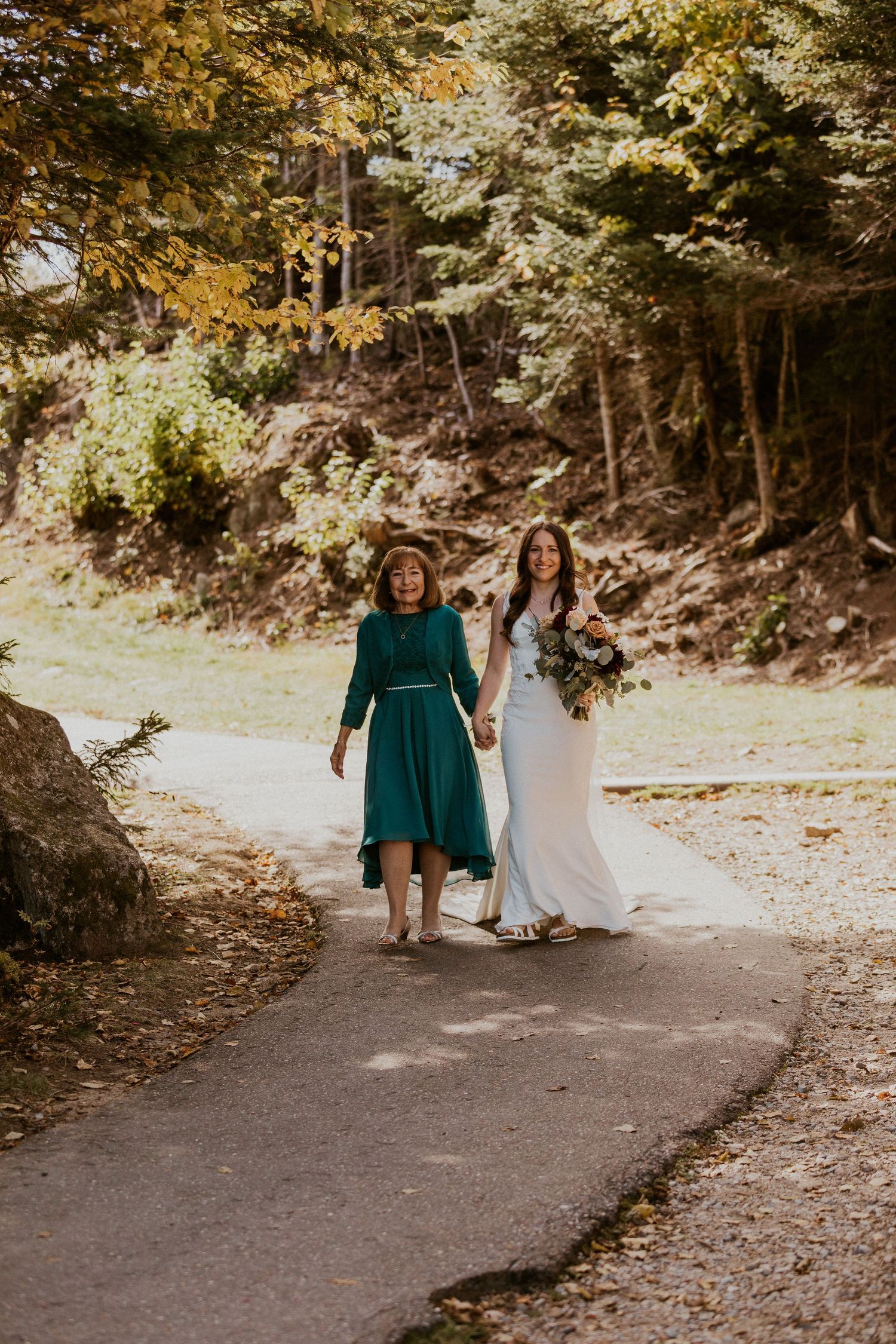 Bri walking down the aisle with her mother during the wedding ceremony on Loon Mountain.