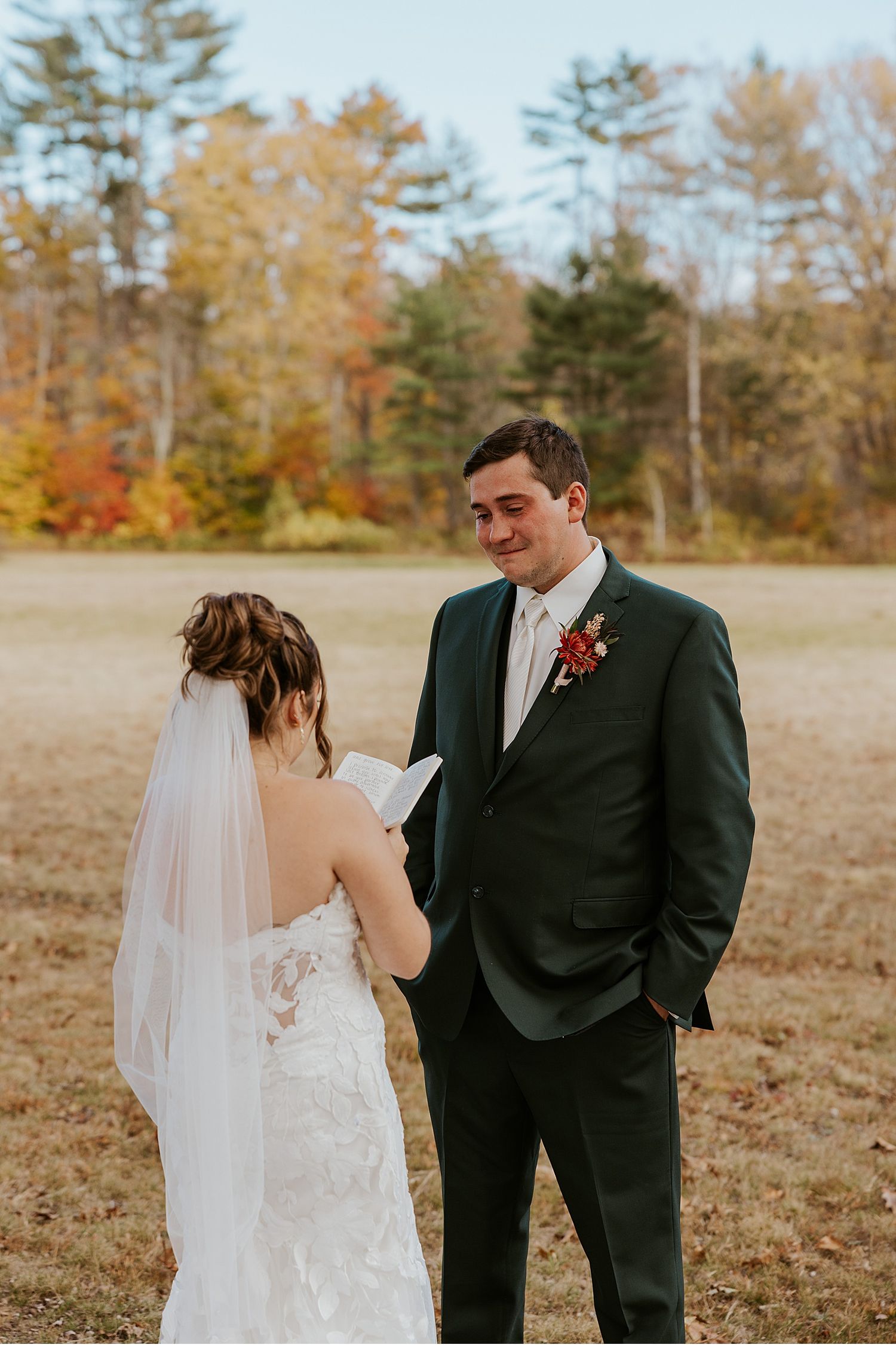 Bride and groom taking first look wedding photos at their Maine wedding