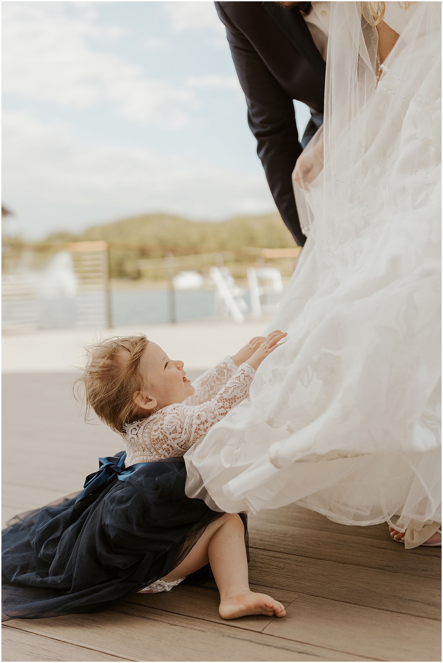 bride and groom and their daughter at owls nest wedding nh