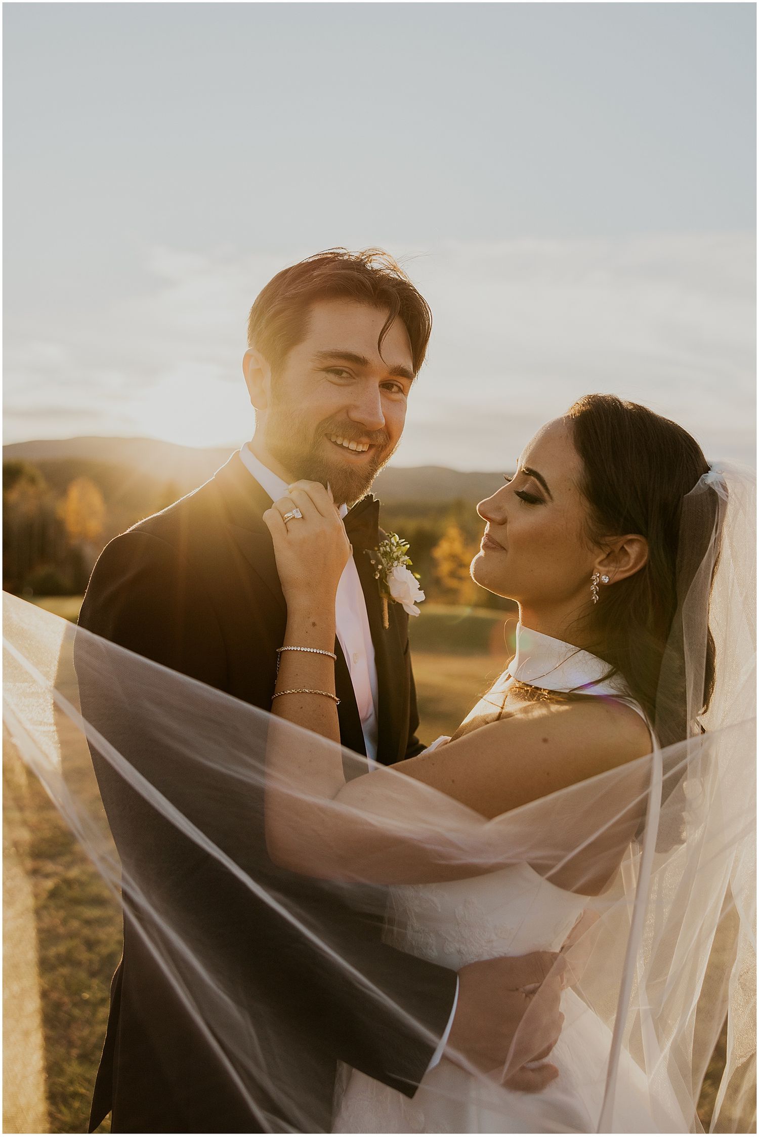 Bride and groom taking sunset portrait photos at the Owl's Nest Resort