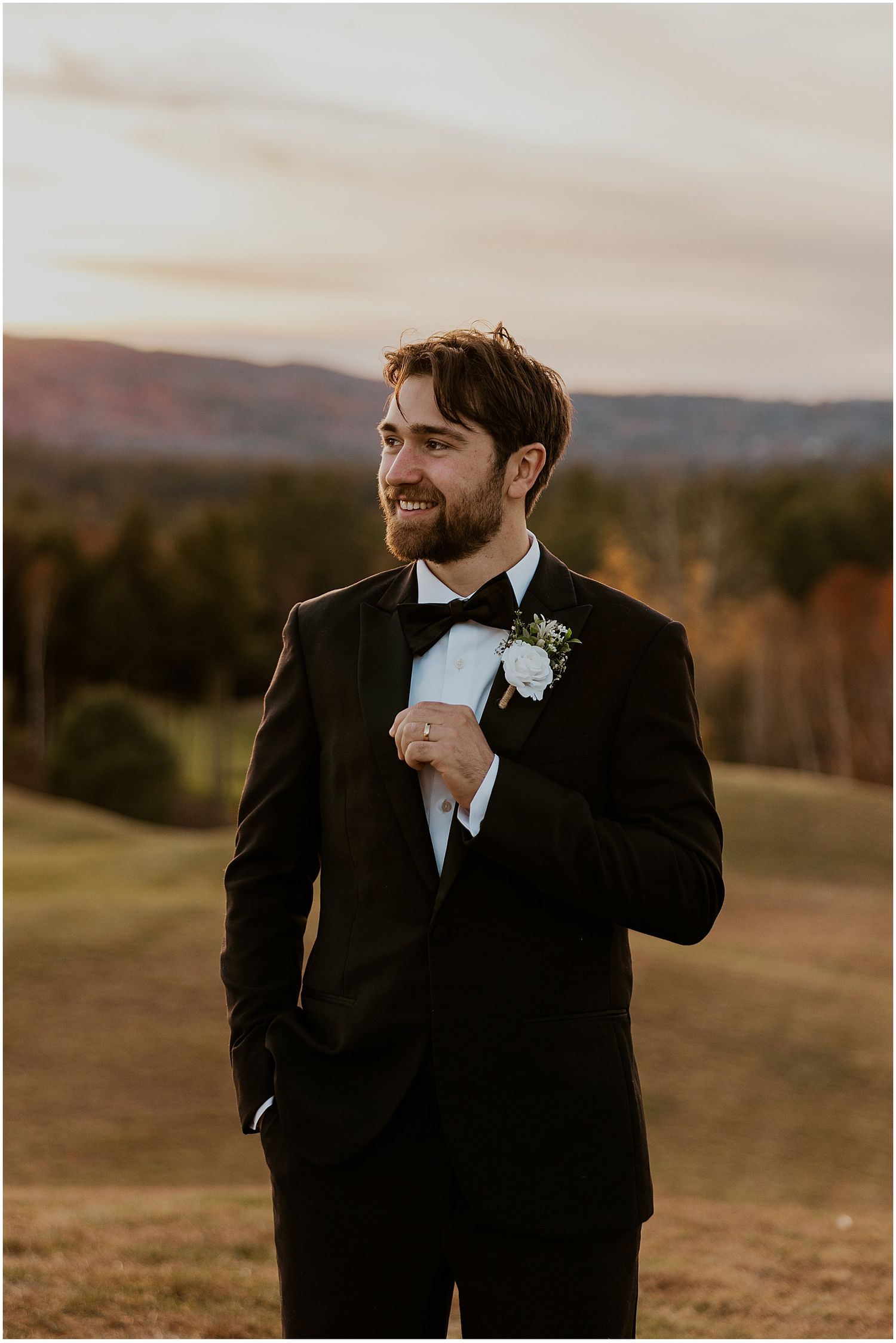 NH groom taking golden hour wedding photos