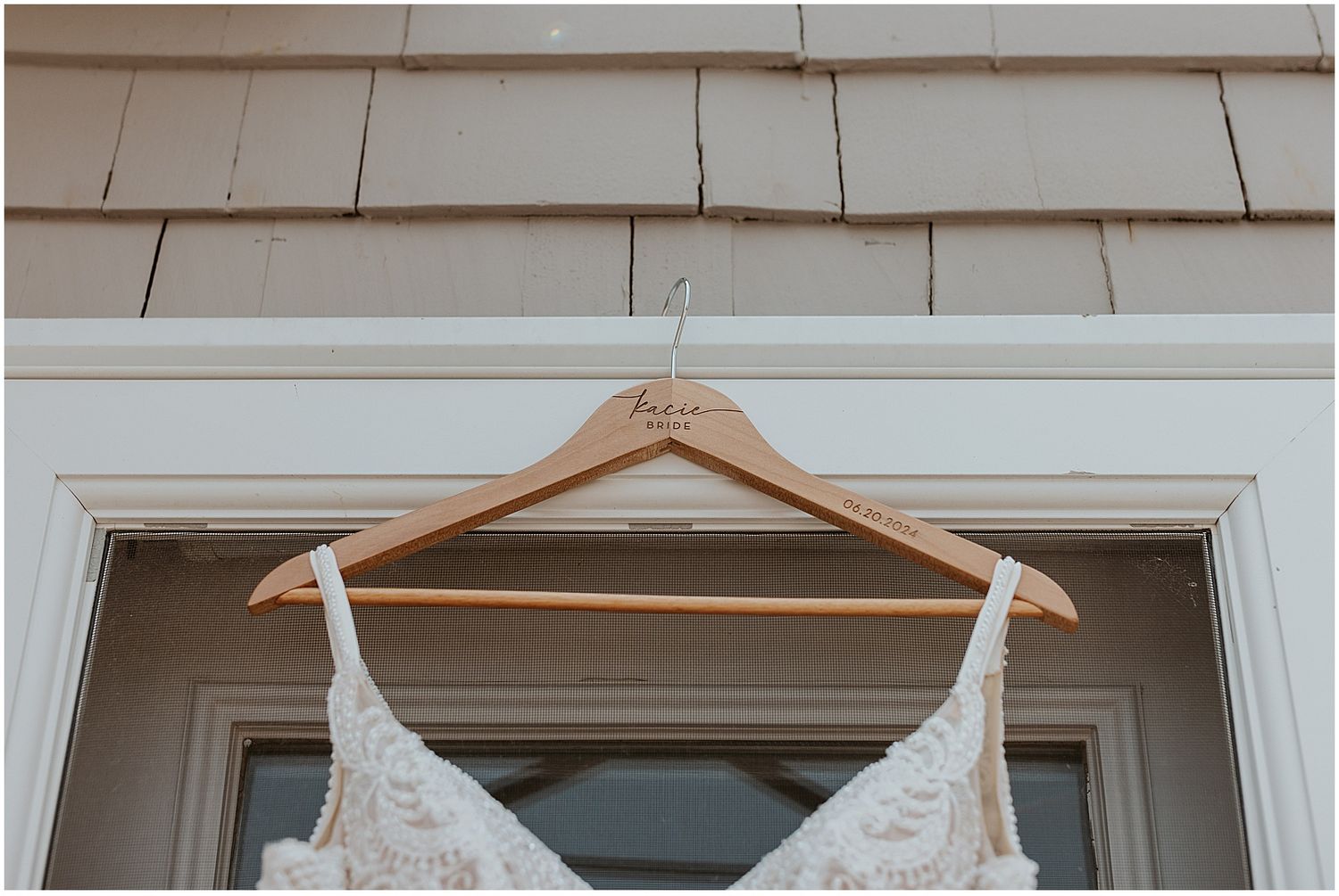 Bridal gown on engraved hanger for NH wedding
