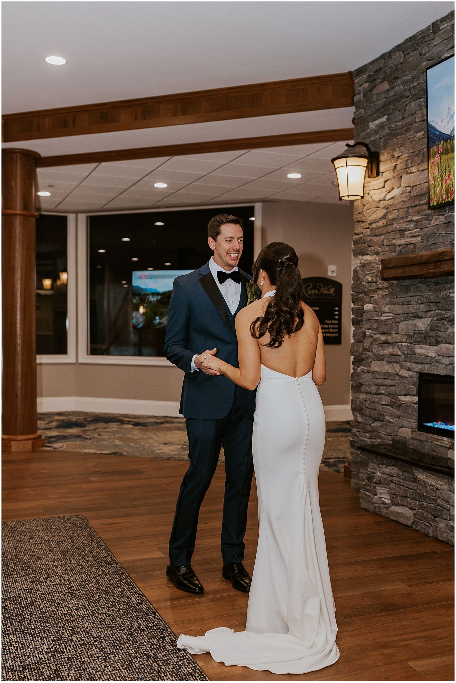 Bride and groom sharing a first look at River Walk Resort NH