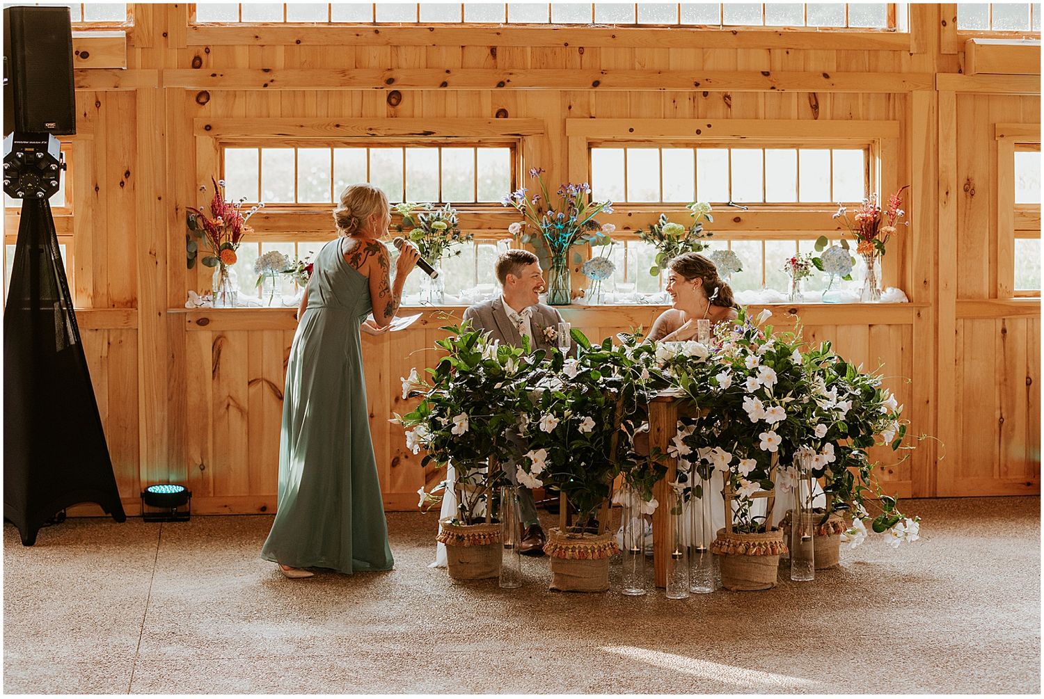 Bridesmaid giving a toast at the outdoor wedding venue in NH Locke Falls Farm