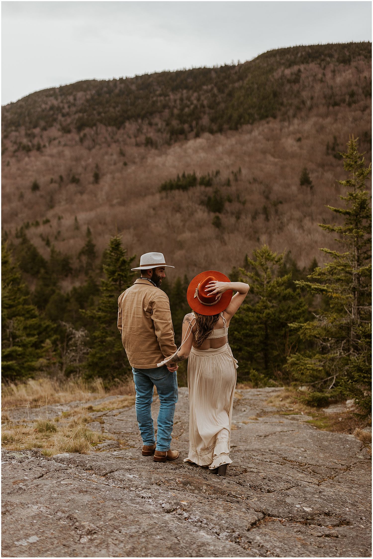 NH couple taking boho engagement photos in the White Mountains
